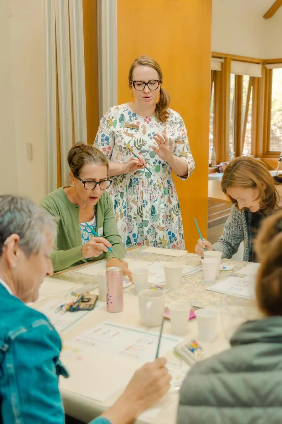 Illustrator Helen Ridley talking and demonstrating at a watercolour workshop