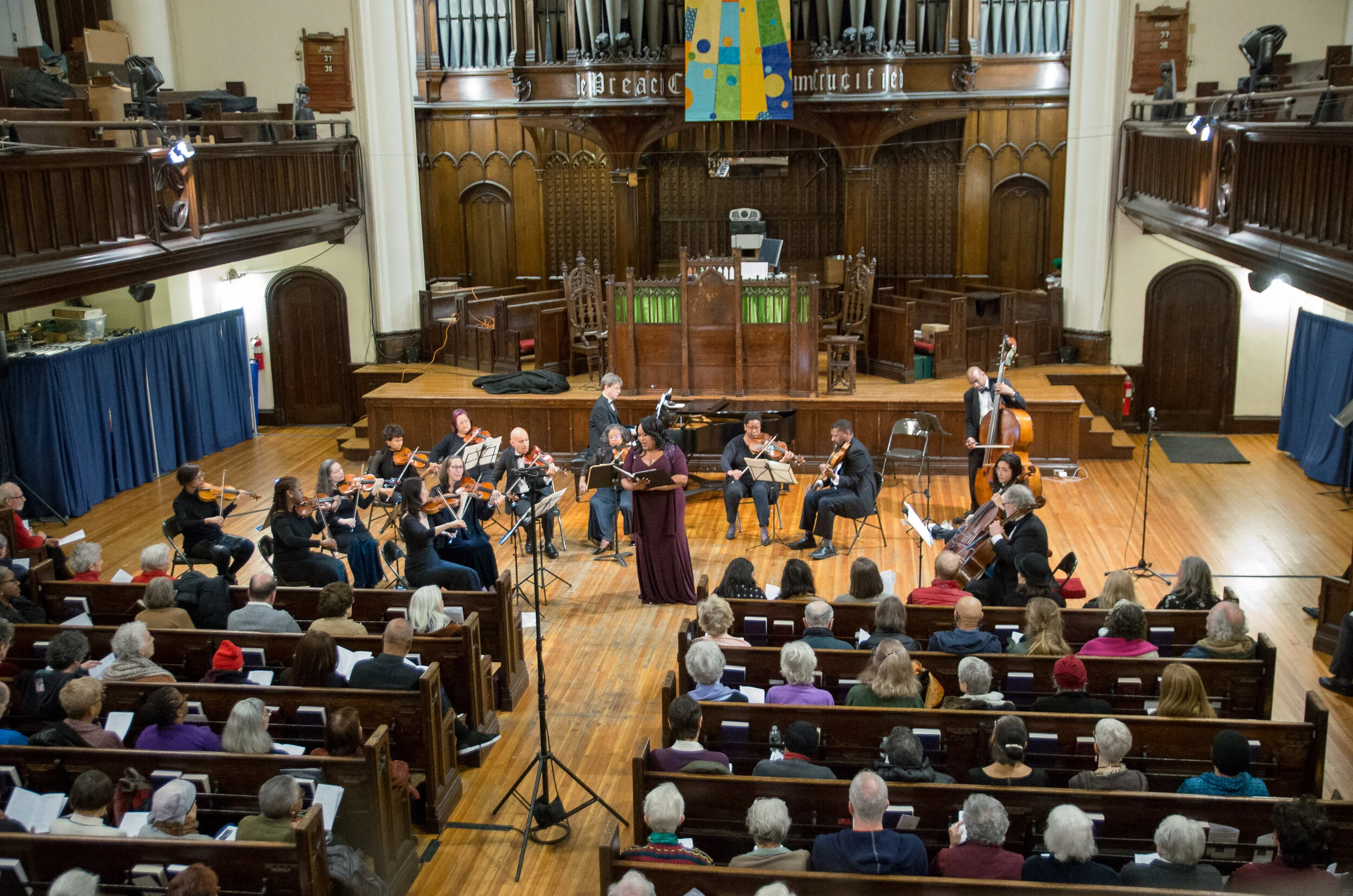 Mezzo-soprano Lucia Bradford singing at an Annual Bach Concert.
