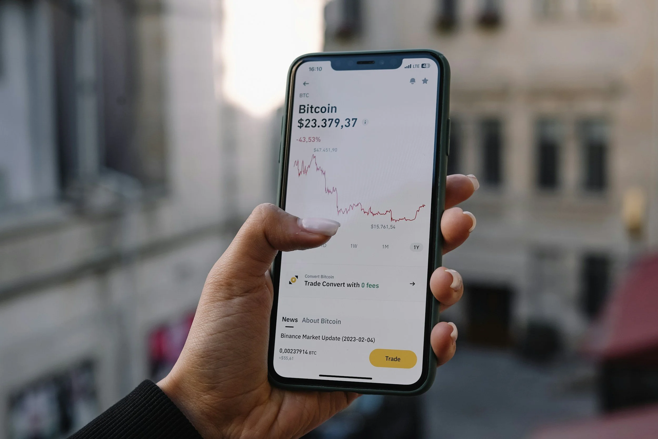 investing on phone woman holding