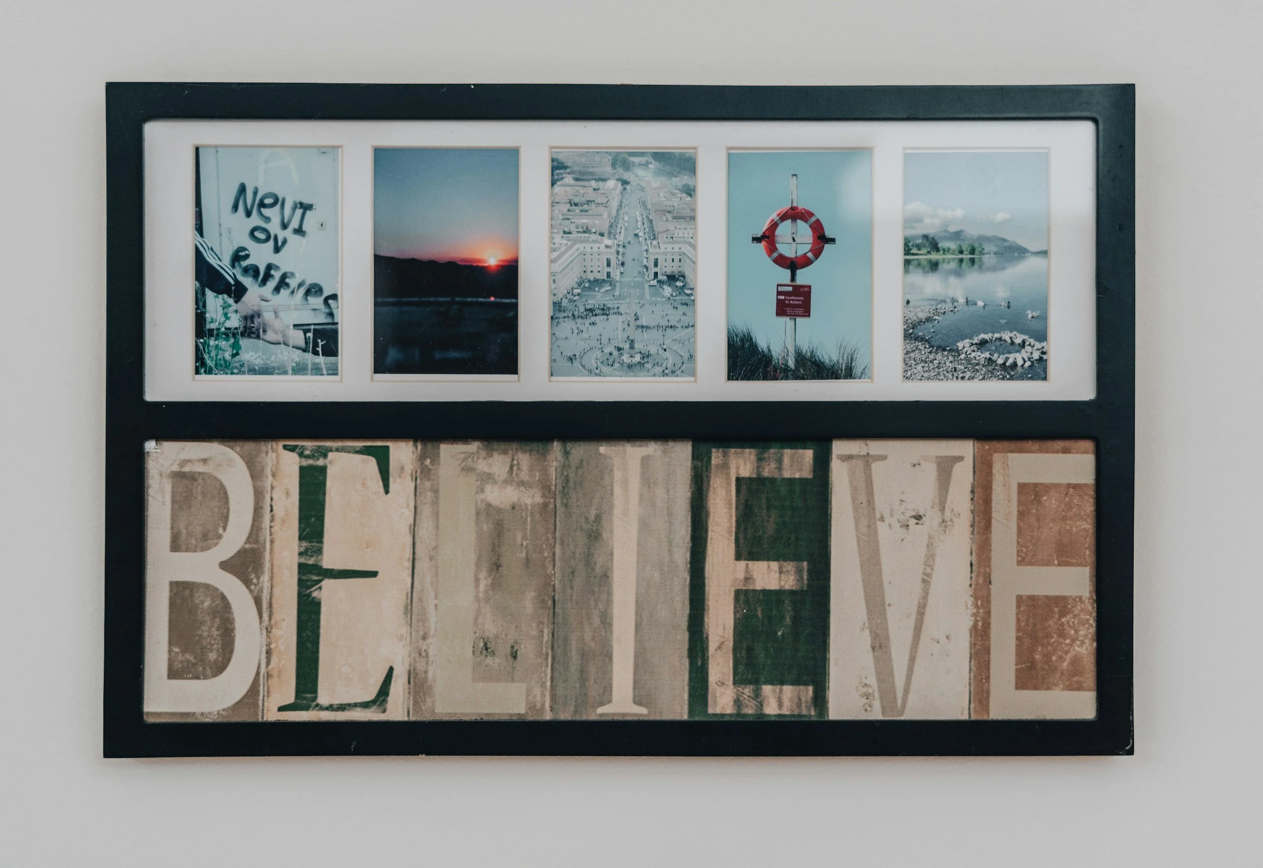 mural with words believe on it and landscape images