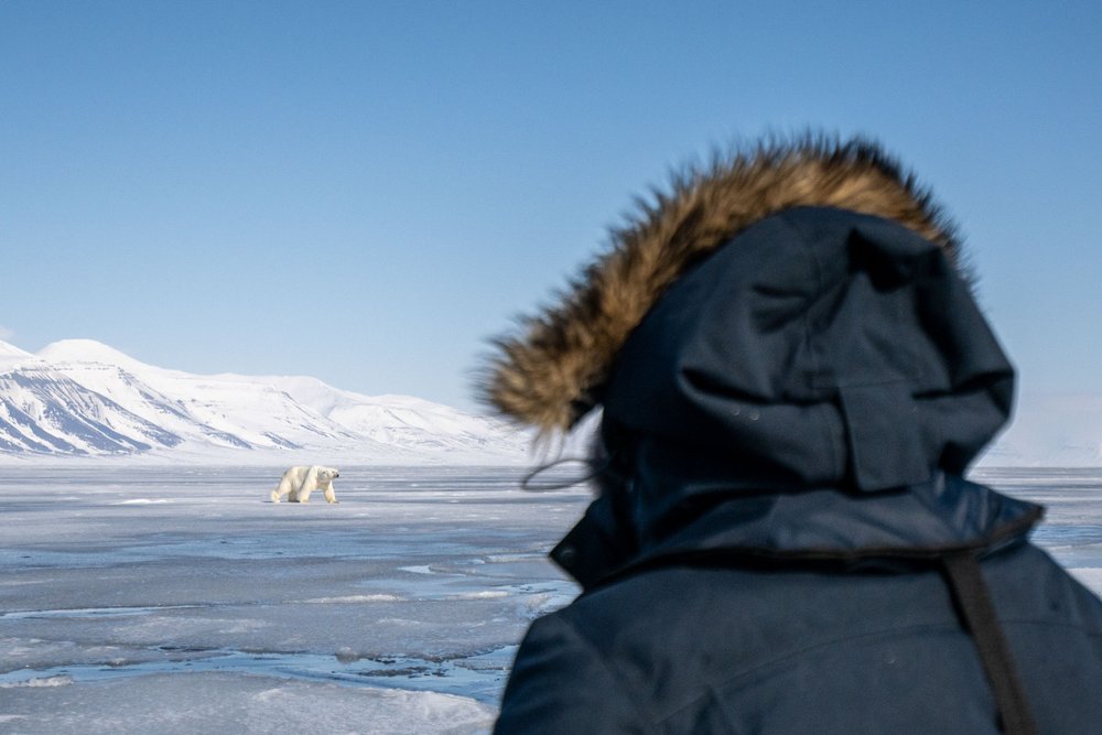 Guest_in_front_of_a_polar_bear_Svalbard_22_DavidGonzalez_SecretAtlas.jpeg