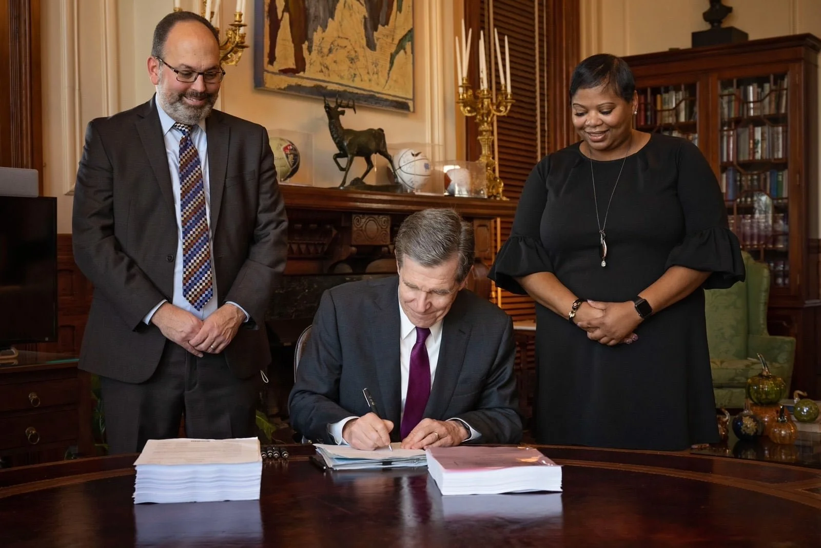 Cooper signs first budget as governor