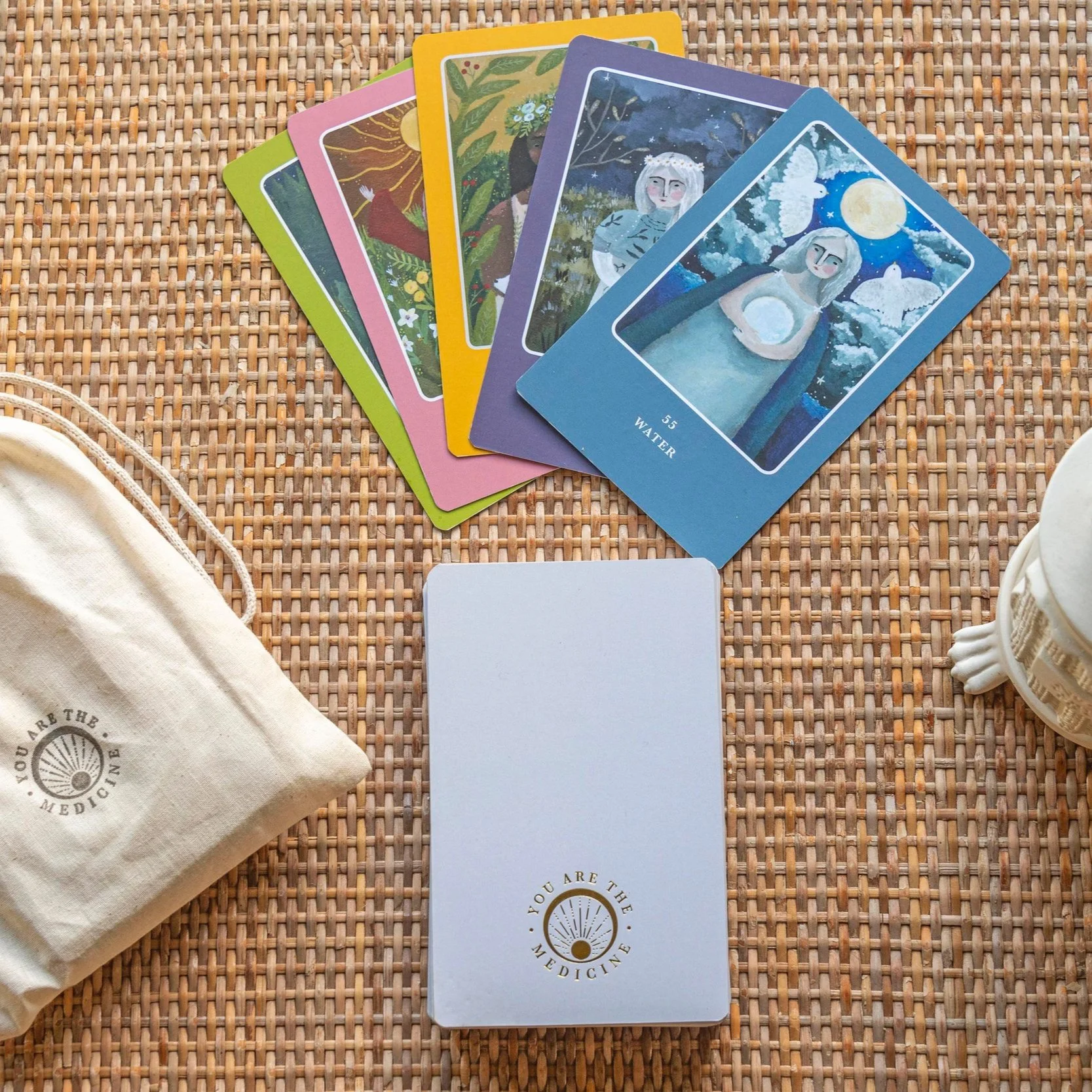 Medicine women deck of cards on woven mat