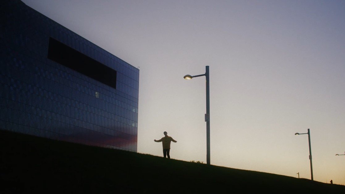 Man dancing under streetlight, silhouette, The Kiln video production