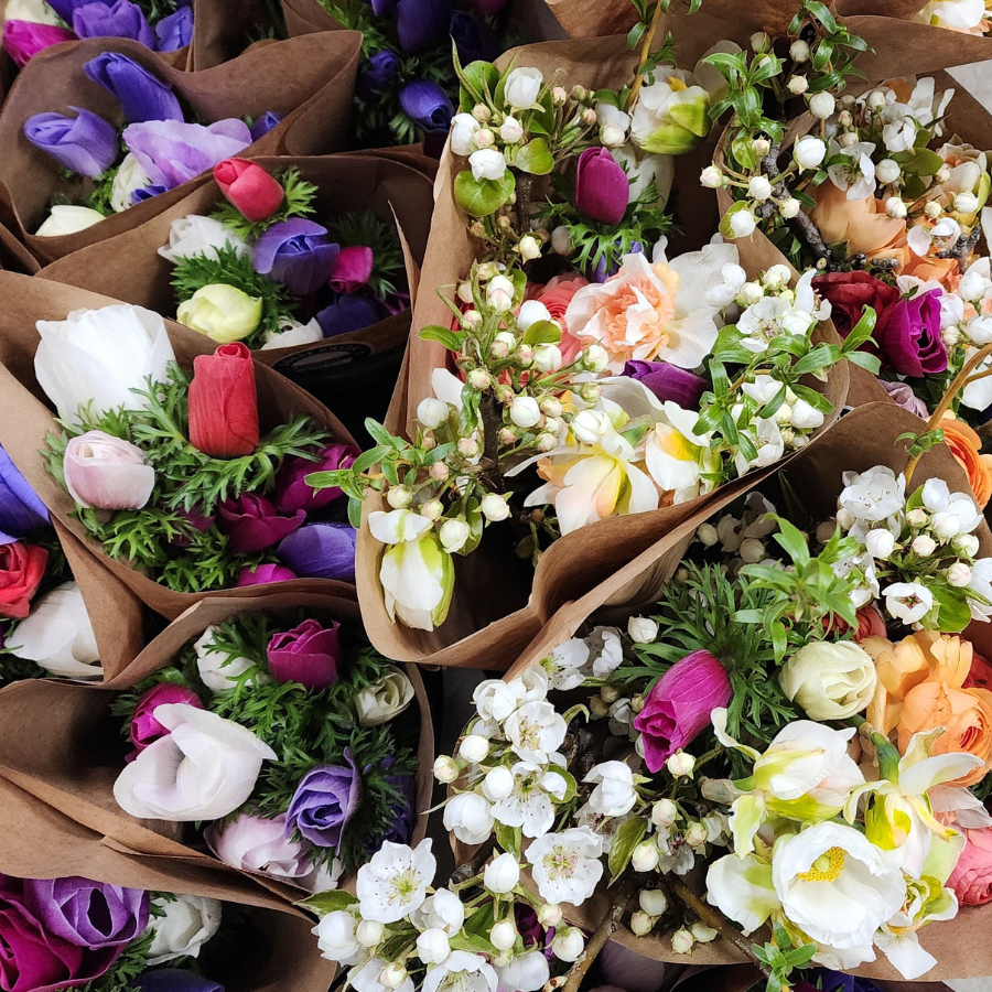 A close up of Amenone and Ranunculus flower bouquets