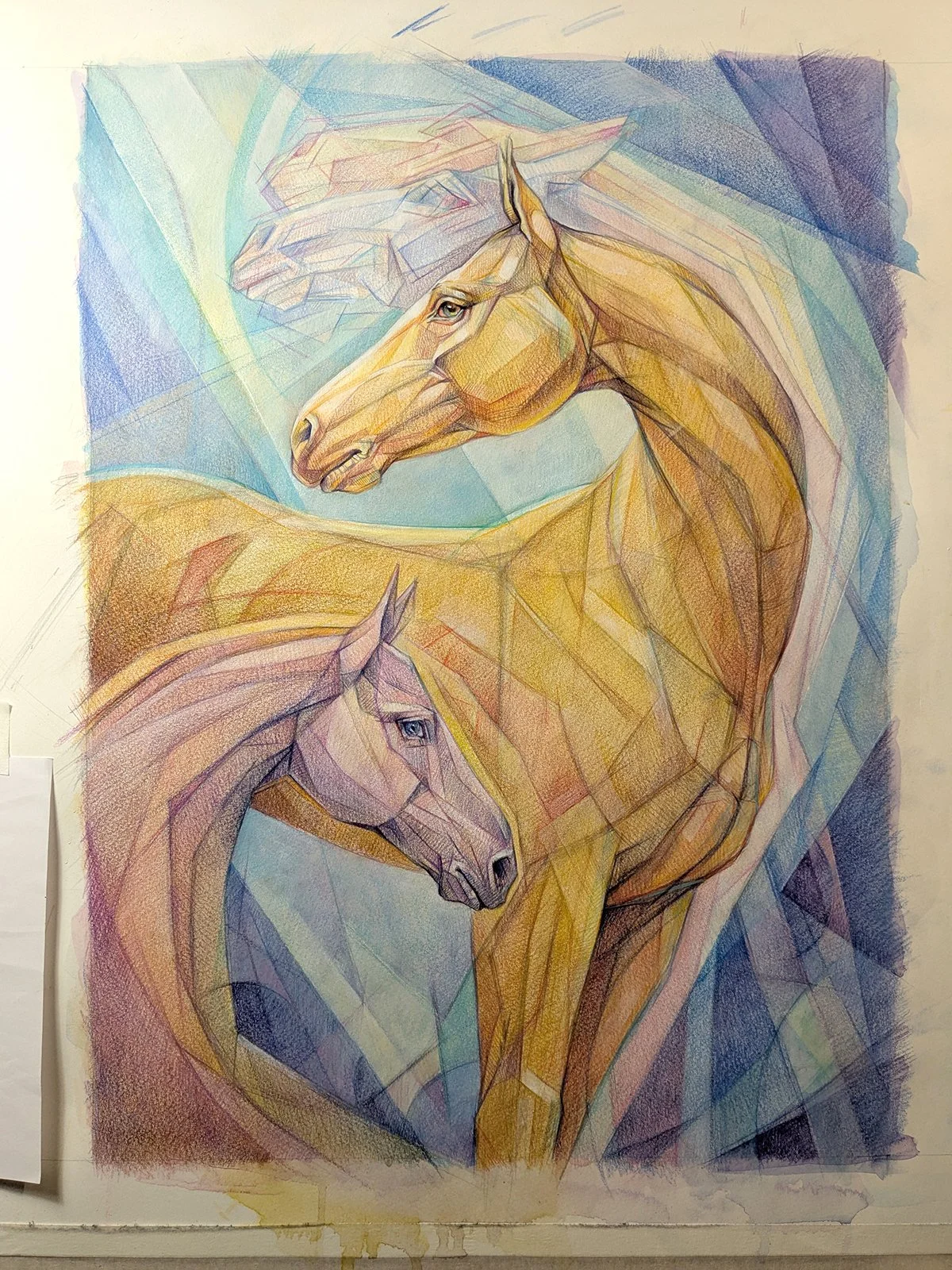 A colorful, geometric-style drawing of three horses with different colors and detailed faces.