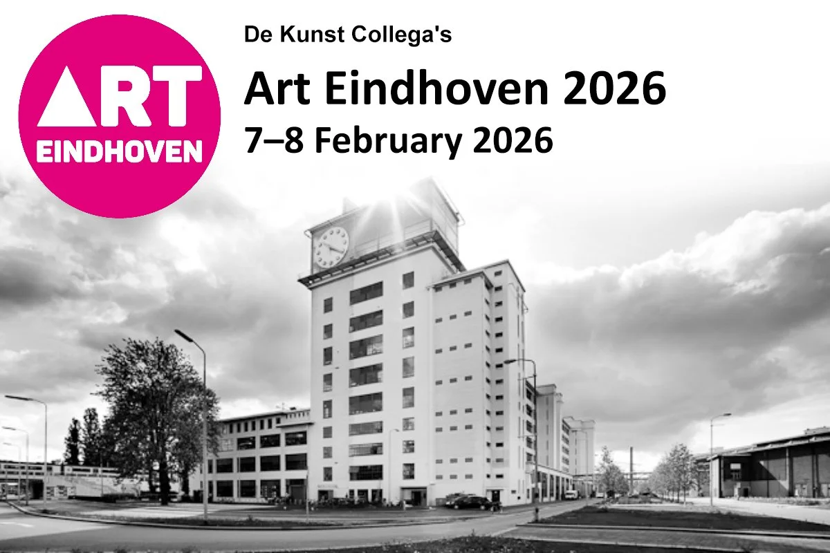 Black and white photo of a modern high-rise building with a clock tower, trees, street lamps, and parked cars in front, under a cloudy sky.