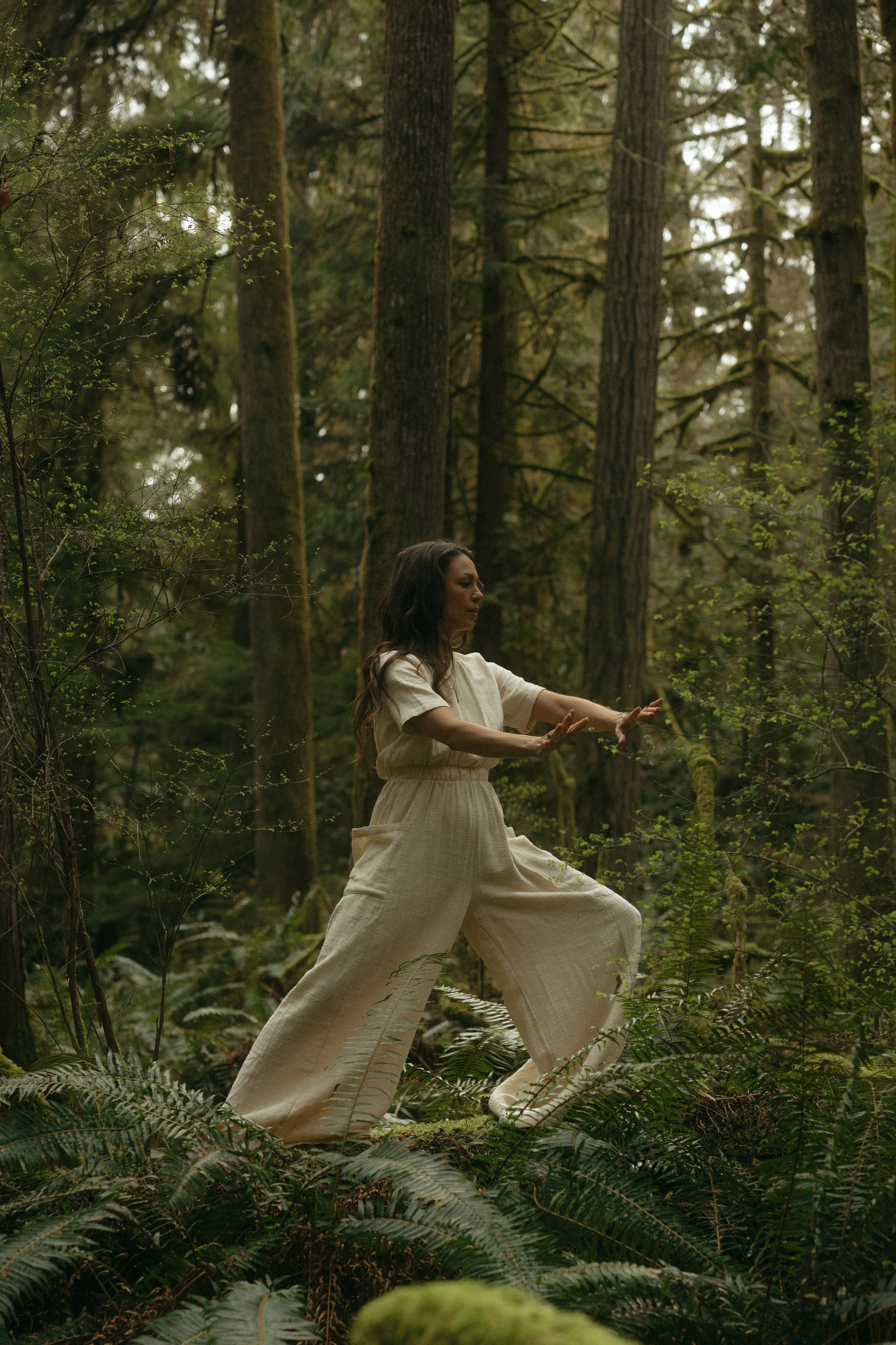 image of stephanie practicing qigong in the forest