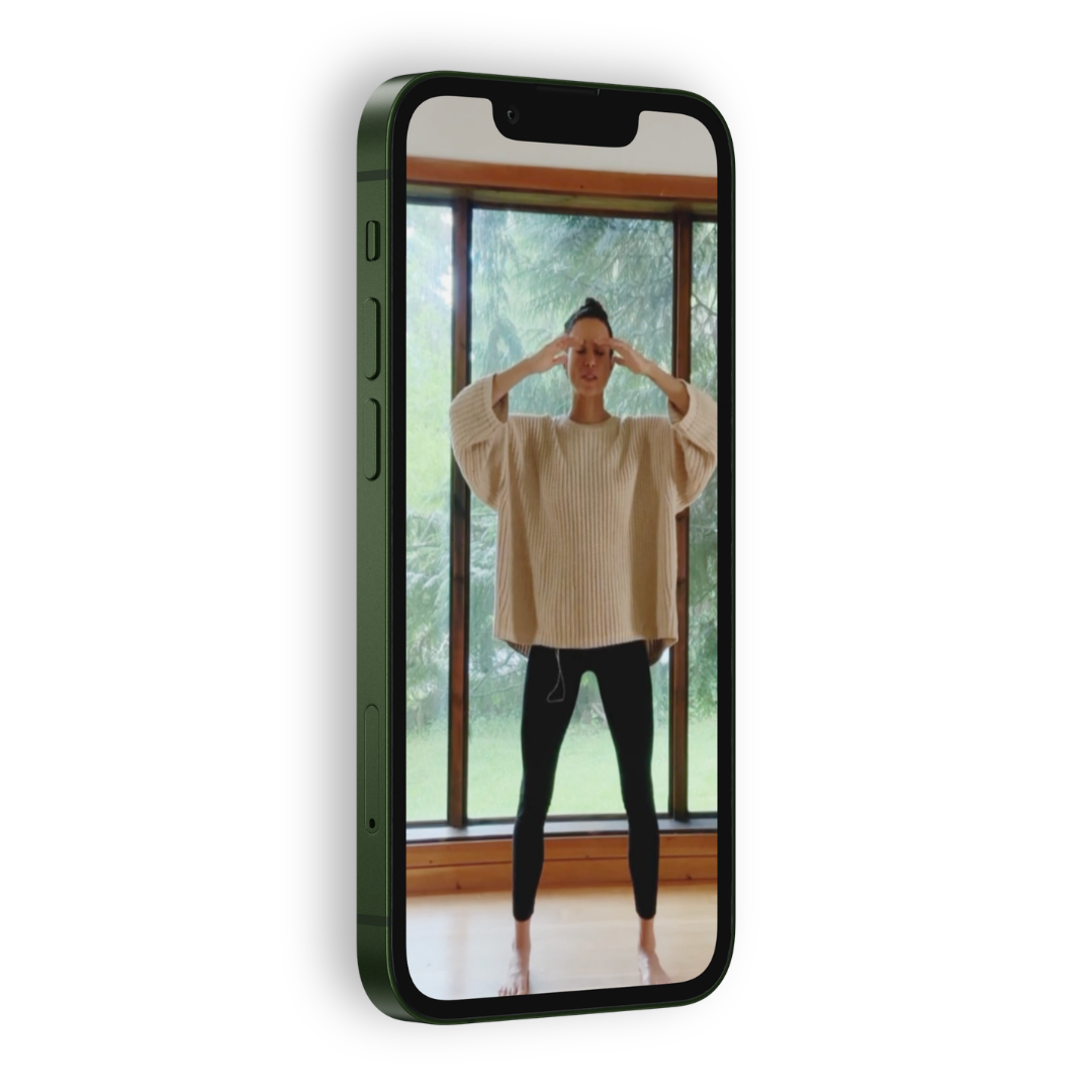 phone that shows Stephanie Nosco guiding Qigong class
