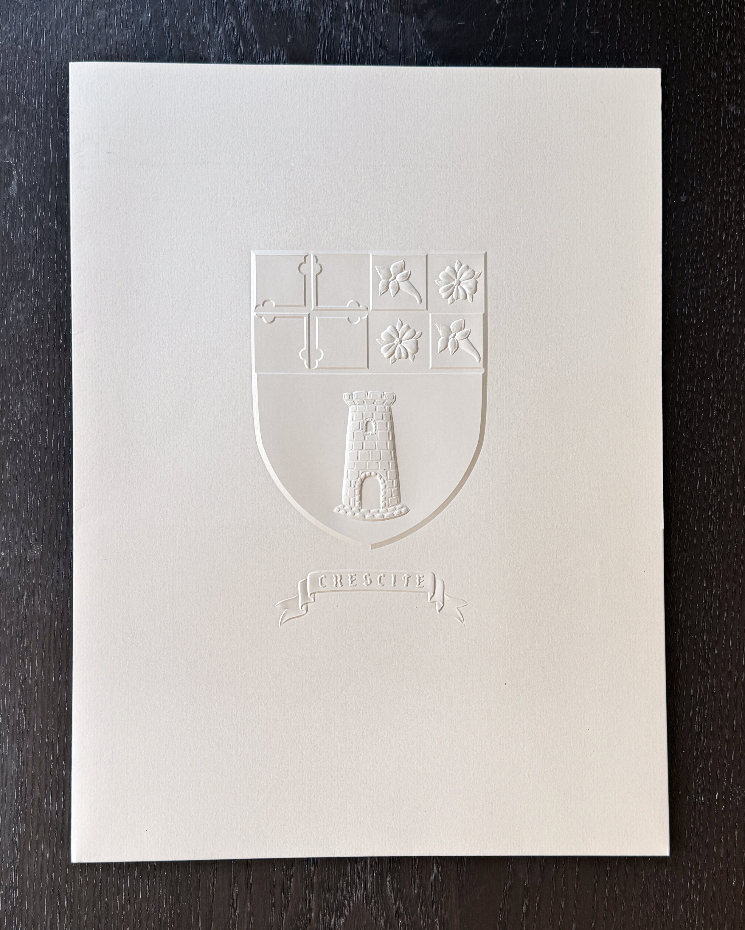 Large pocket folder for The Heights School with crest blind-embossed on cover