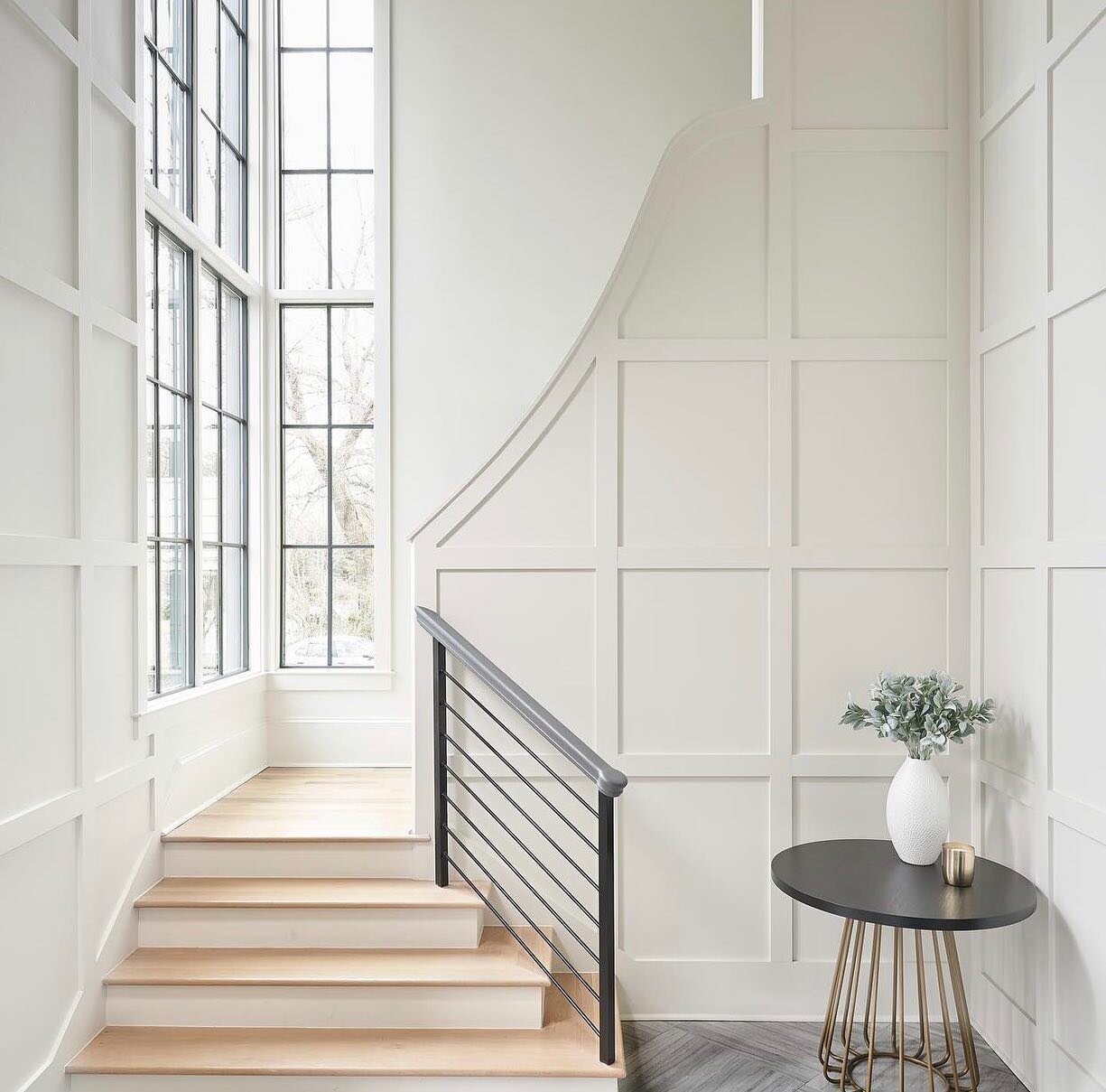 A grand entrance for a new week. A textured wall, the elongated windows, an angular railing, all working together to accentuate the foyer&rsquo;s high ceilings. - M