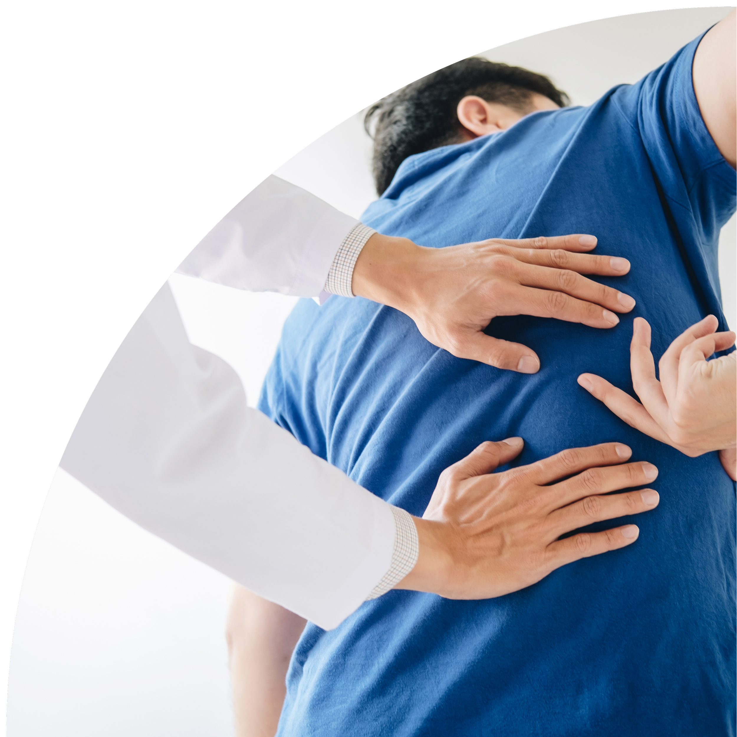 Medical professional examining a patient's back for discomfort.