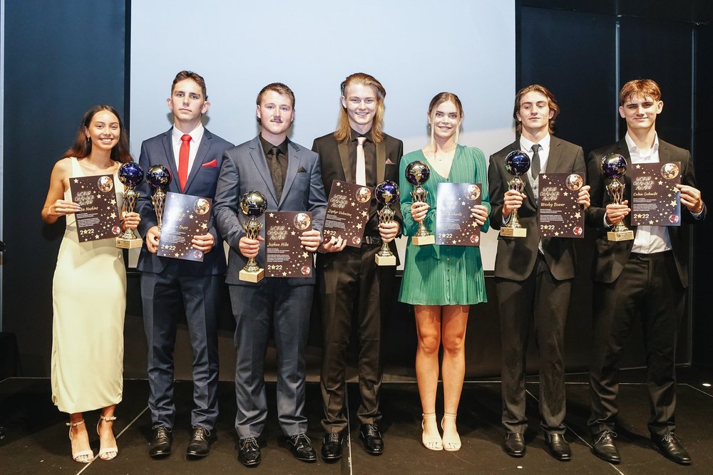 Australian Institute of Learning graduates holding certificates and awards at a graduation event