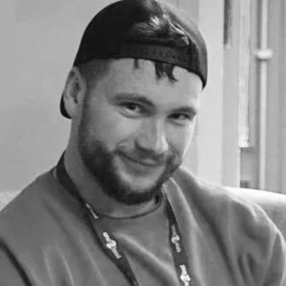 Black and white photo of tom binding