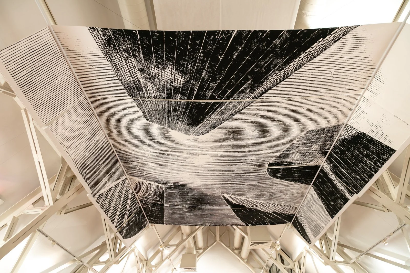 Textured ceiling panels depicting abstracted cityscape by Gábor Koós, from USA Diary installation.