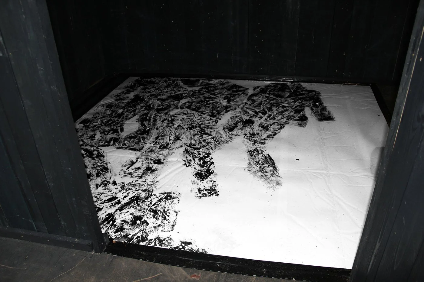 Visitors engaging with Gábor Koós’s installation on the historical site of the Jewish ghetto in Budapest.