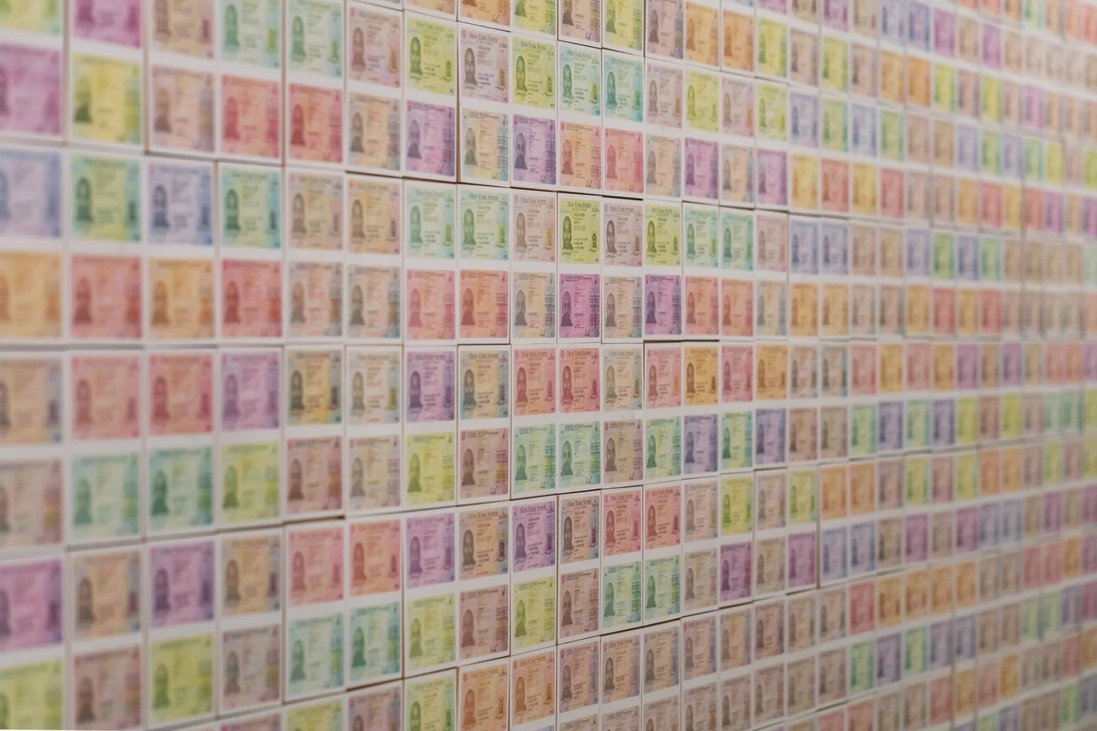 Documentation-based wall artwork reflecting on surveillance and recognition.