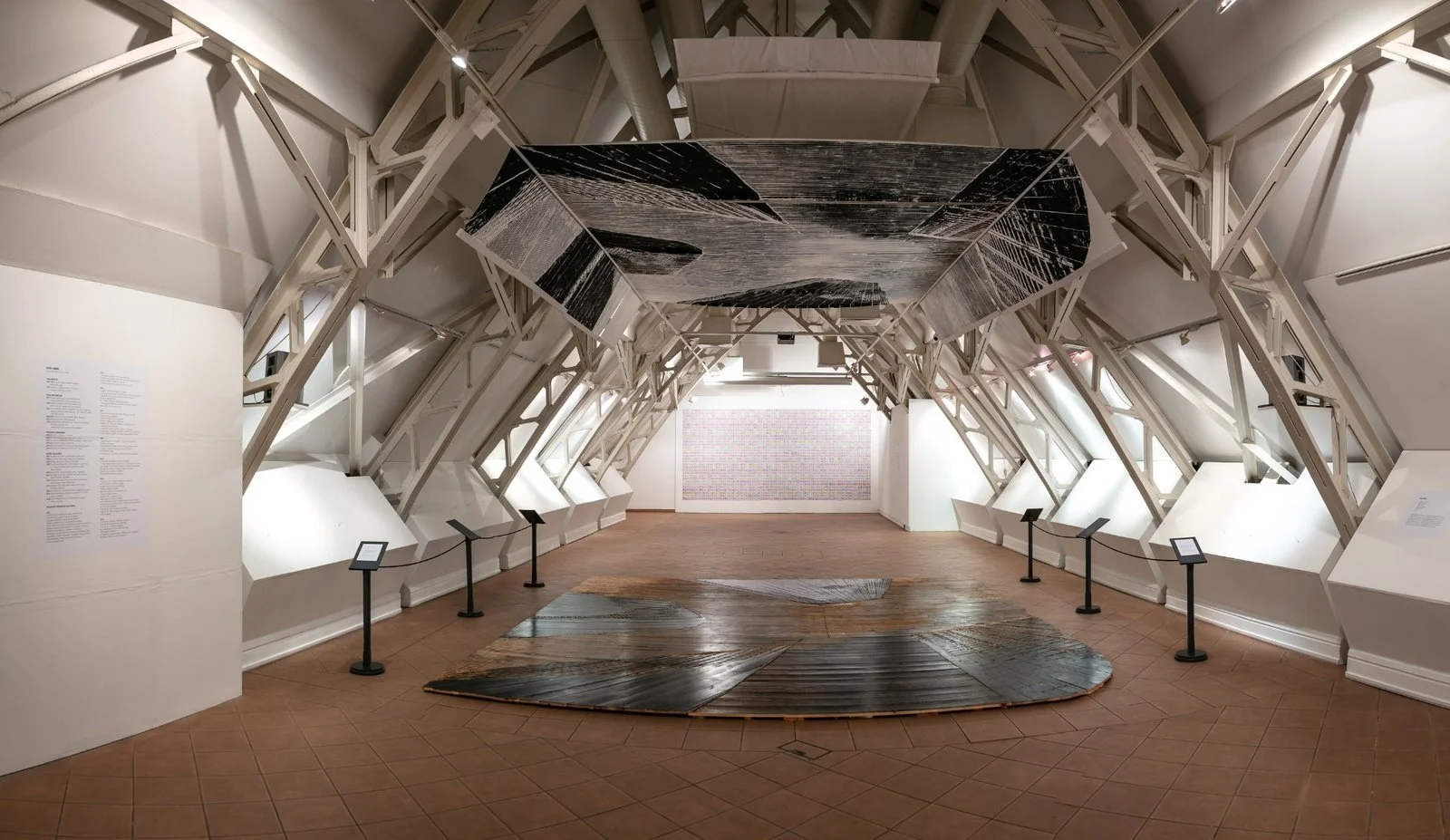 Perspective of architectural installation with black and white woodcut prints, USA Diary by Gábor Koós.