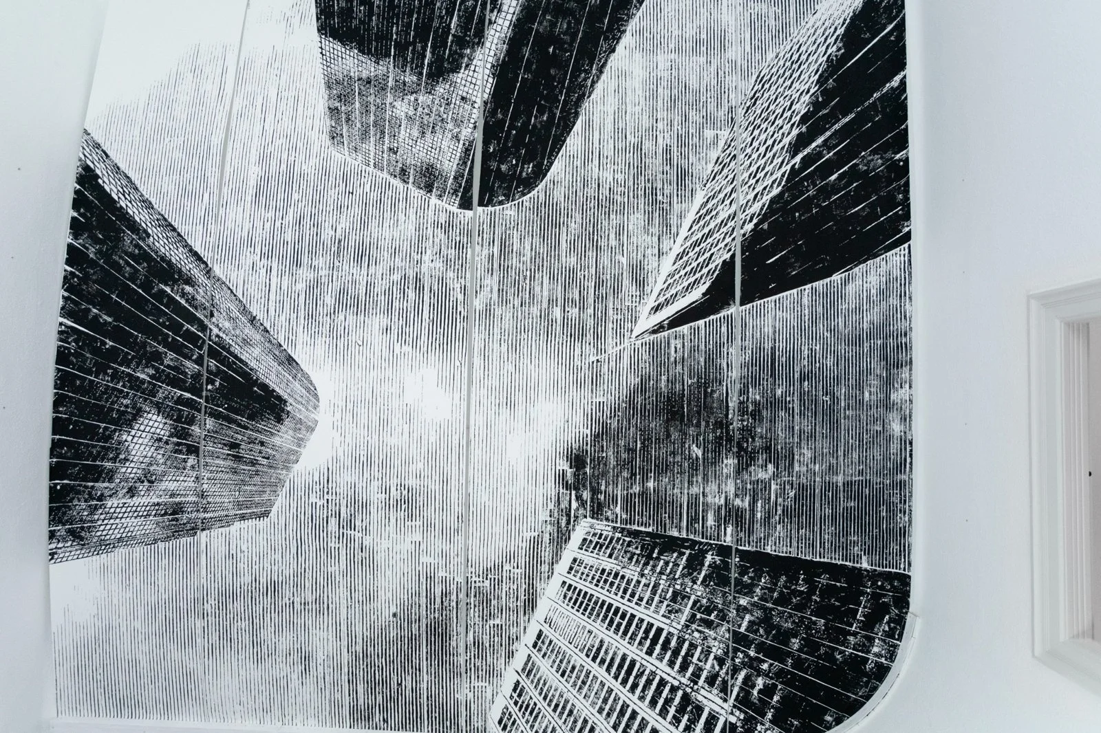 Gábor Koós woodcut installation "L.A. Downtown" from USA Diary, ceiling view with monumental skyscraper prints