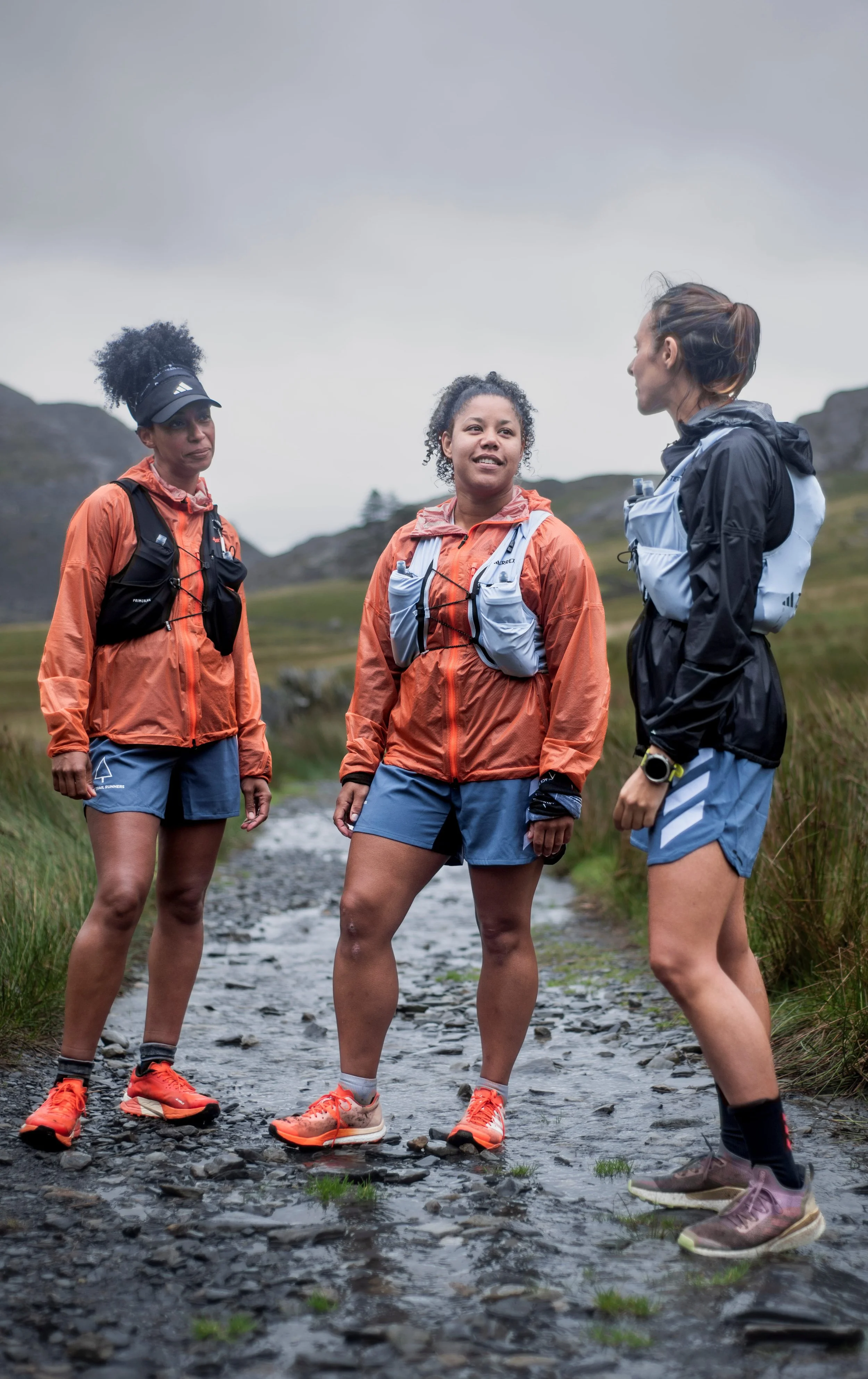Three women trail racing in the rain