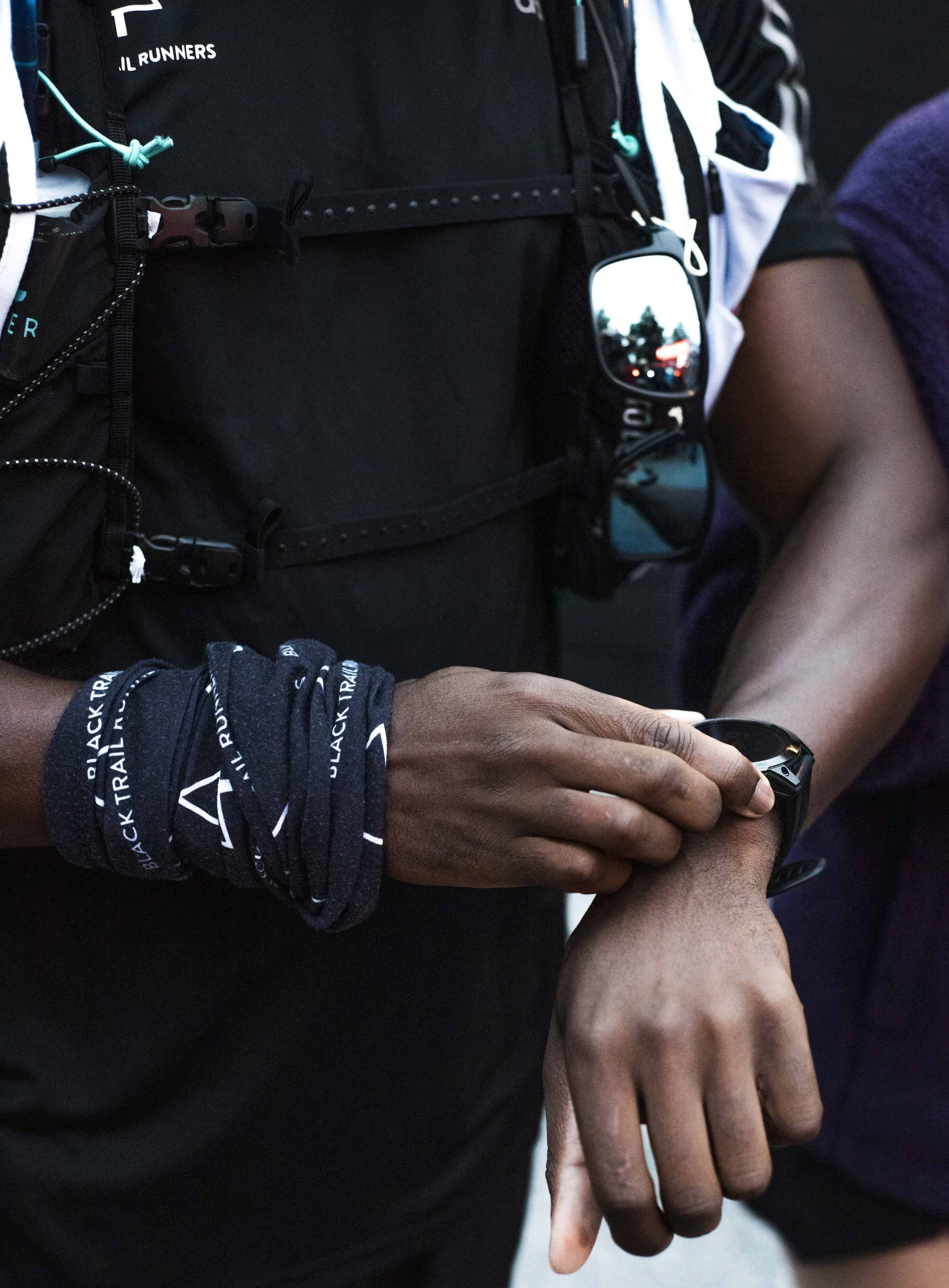 Close-up of a runner checing his smartwatch