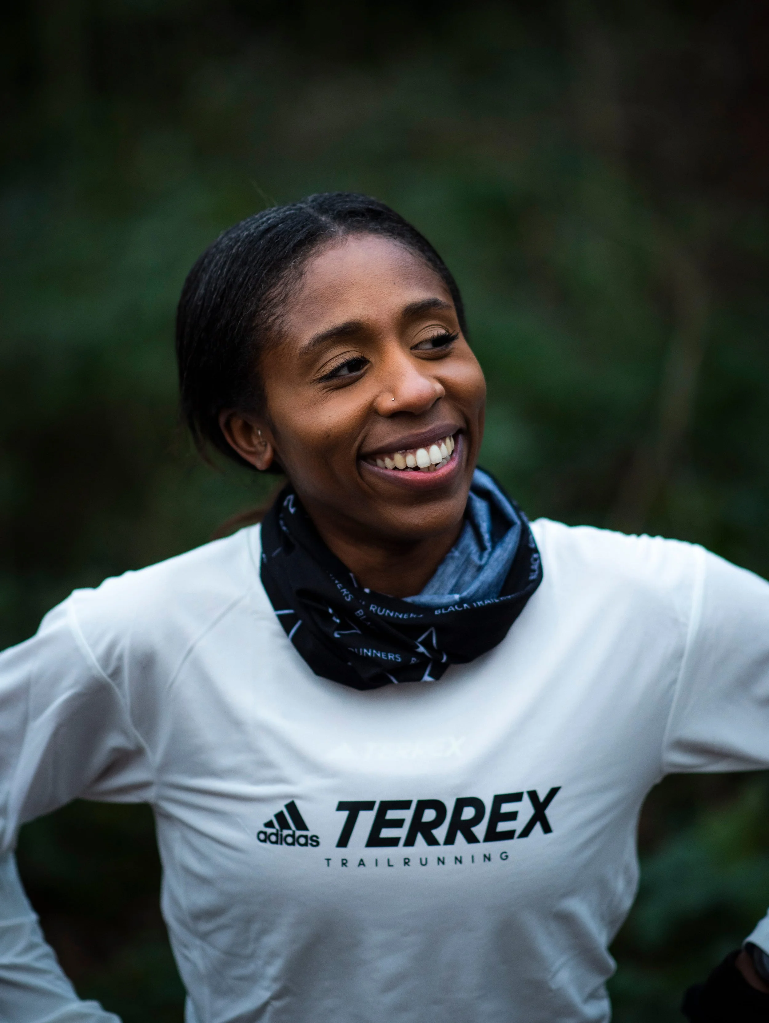 A woman ready for a run smiling