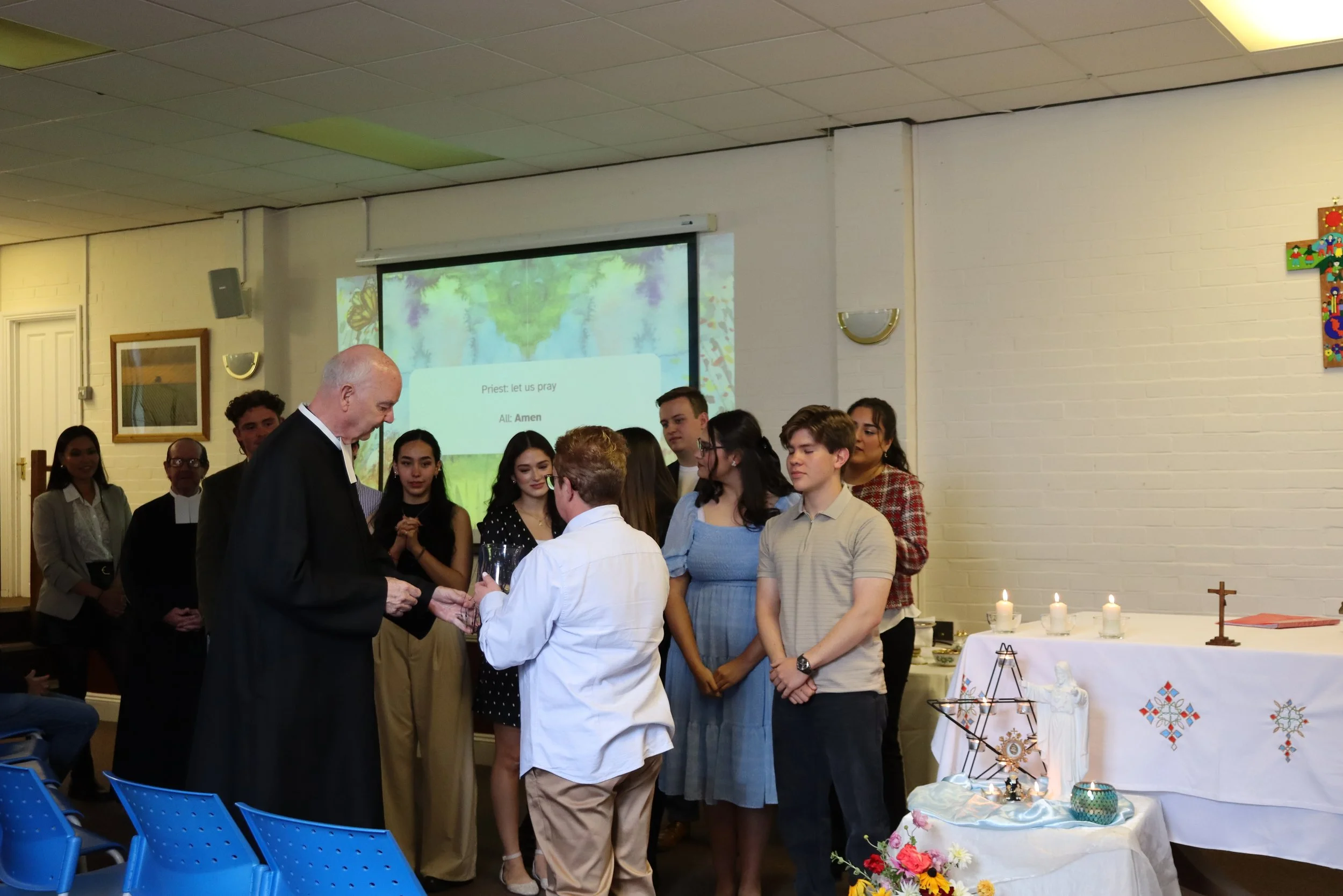 Br. Michael helps Commissioning Team 25-26.JPG