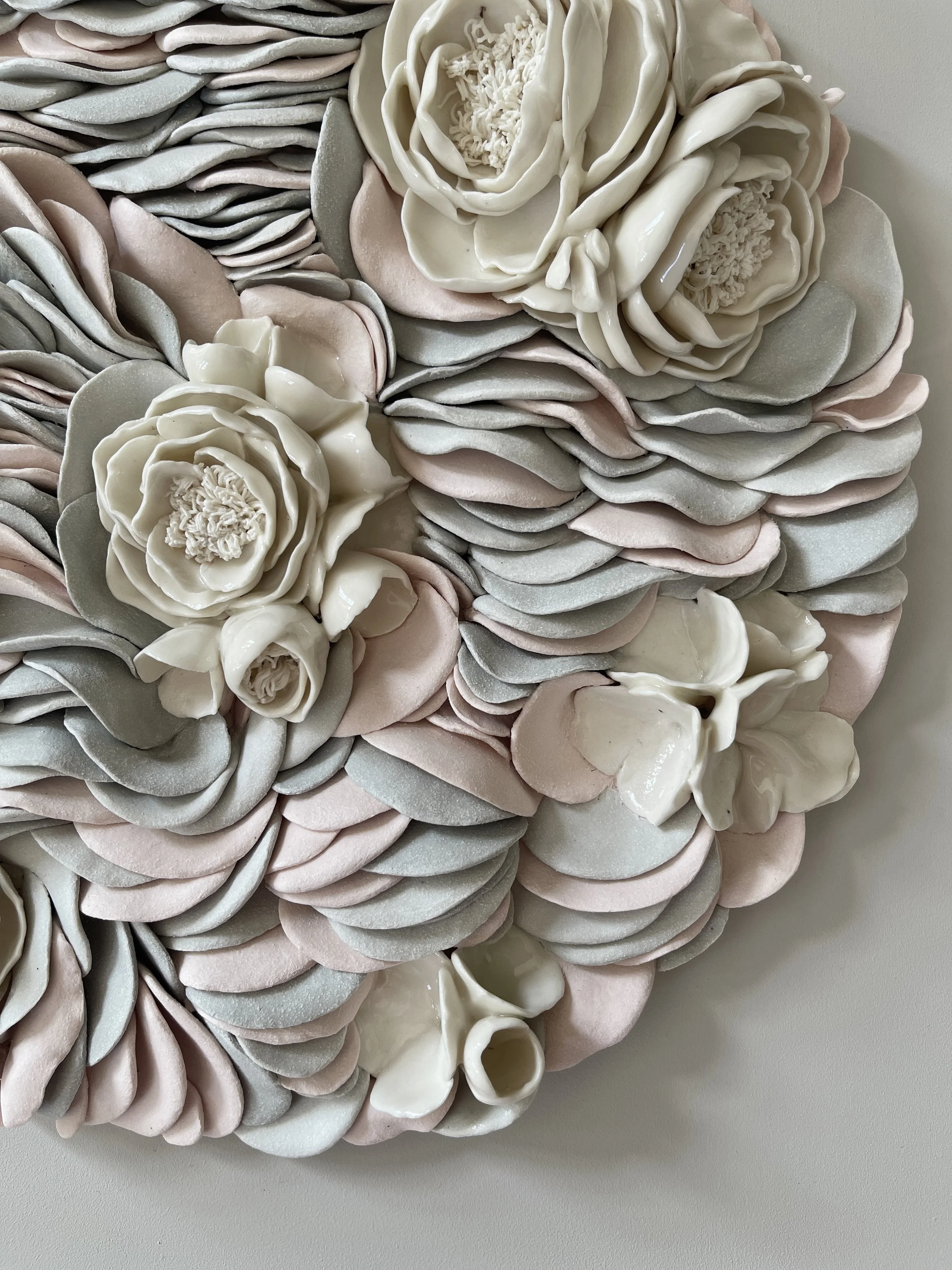 Close -up detail of handcrafted porcelain elements in Floral Ripples, detailing fine craftsmanship and layered texture.