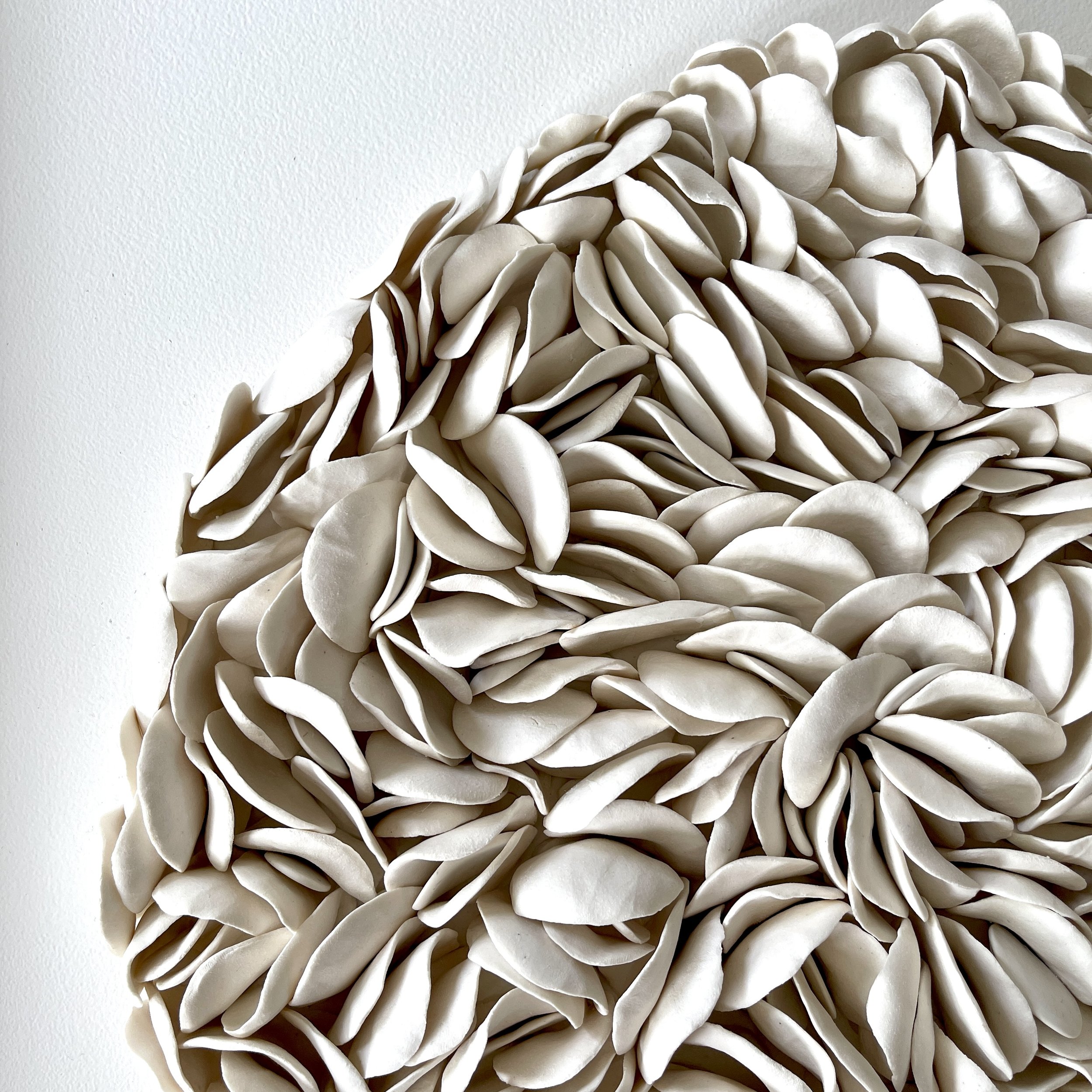 Side profile of Blooming revealing the dimensional relief created by hundreds of hand-formed porcelain elements.