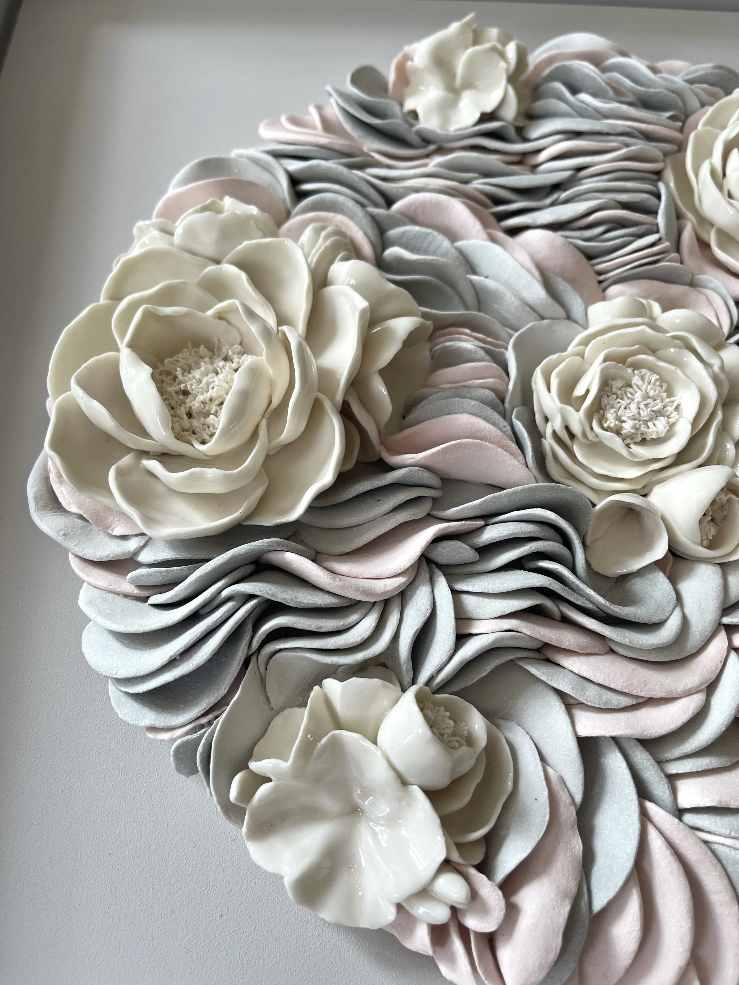Close up view of white porcelain peonies in contemporary artwork Floral Ripples showing textural elements, and contrasting light and shade.