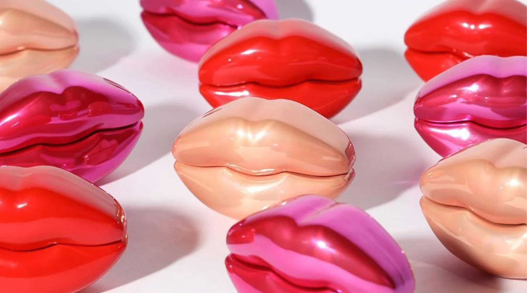 Kylie Jenner by KKW Fragrance bottle design by Precious Brands — lip-shaped packaging in Nude, Pink and Red
