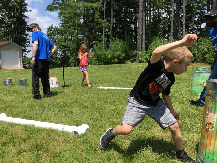 children racing through an obstacle course