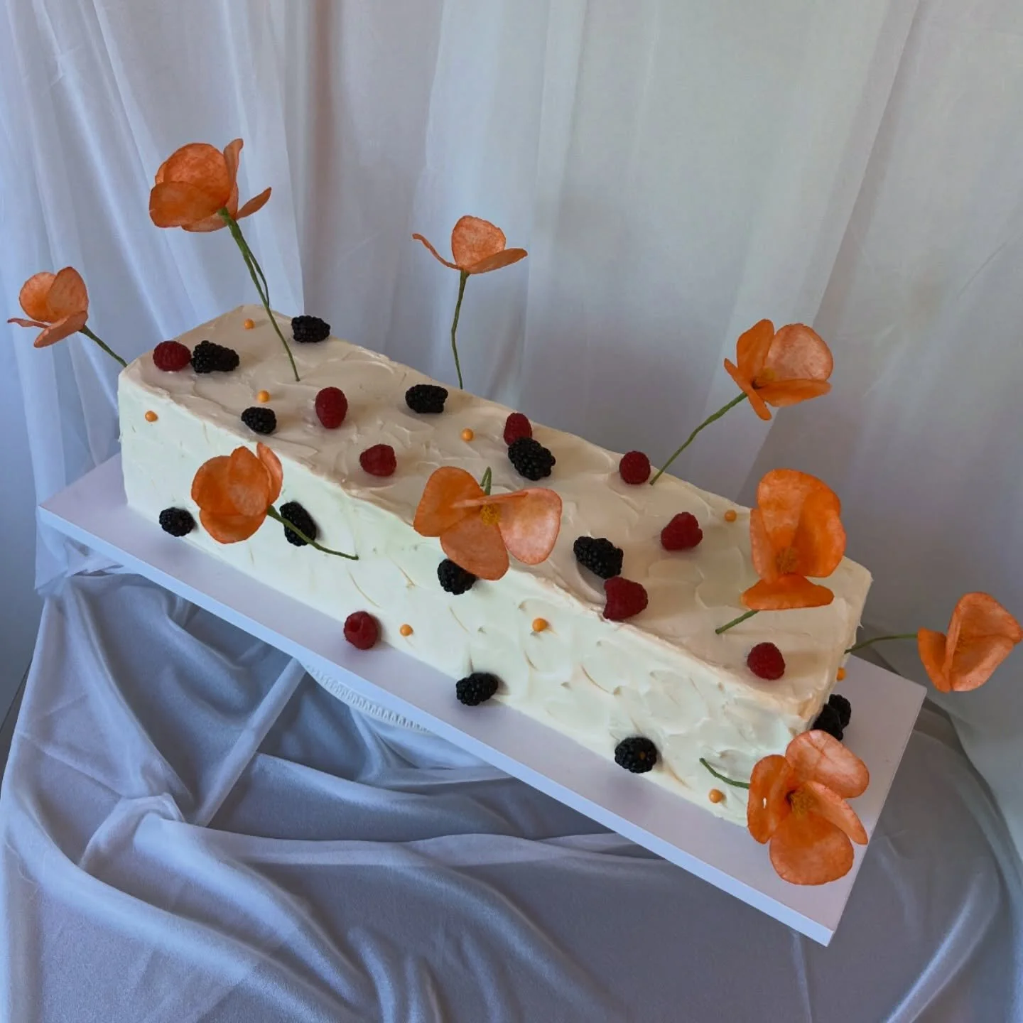Here&rsquo;s my popular &ldquo;Picnic Slab&rdquo; cake dressed up with handmade wafer paper California poppies and fresh berries to celebrate a woman as vibrant, whimsical, and joyful as this design! 

This cake, and many others besides, can be order