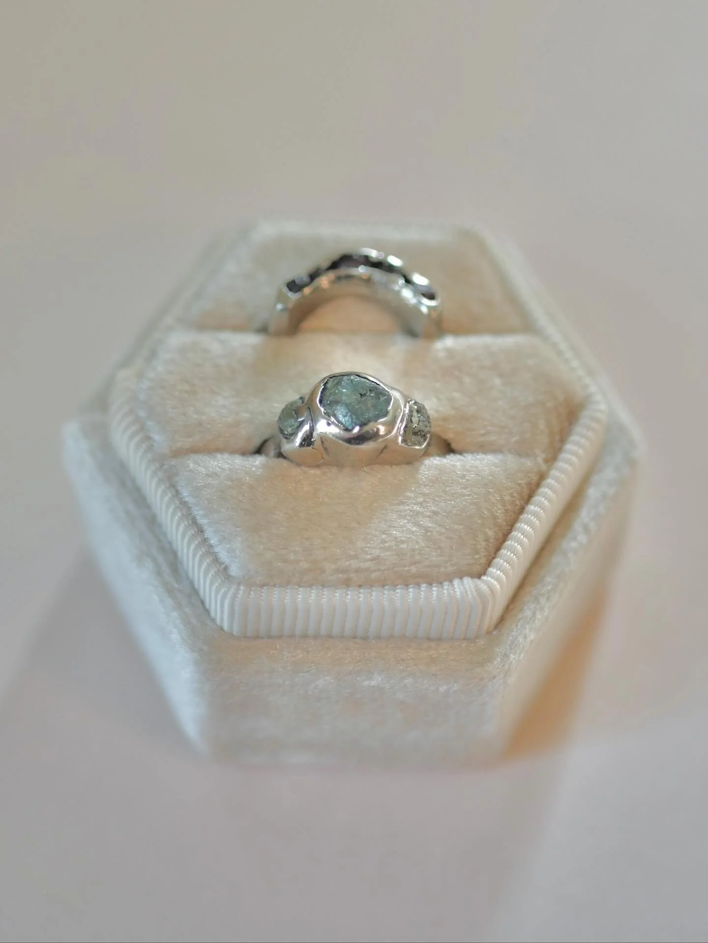 Just finished up a big one: a 14k white gold wedding ring set featuring cast-in-place raw Montana sapphires and garnets from these mountains, stones collected by family members and by the engaged couple themselves. A massive thank you to my very tale