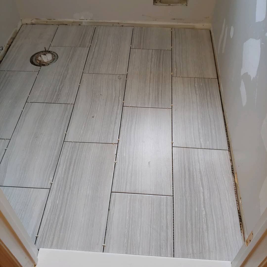 Quick overhaul of a small guest bath. Starting with this 12x24 tile floor. ⠀
⠀
#qualitycraftsmanship #triplerhomeservices #tile #tileguy #tiling #tilefloor #largeformattile #bathremodel #halfbath #remodel