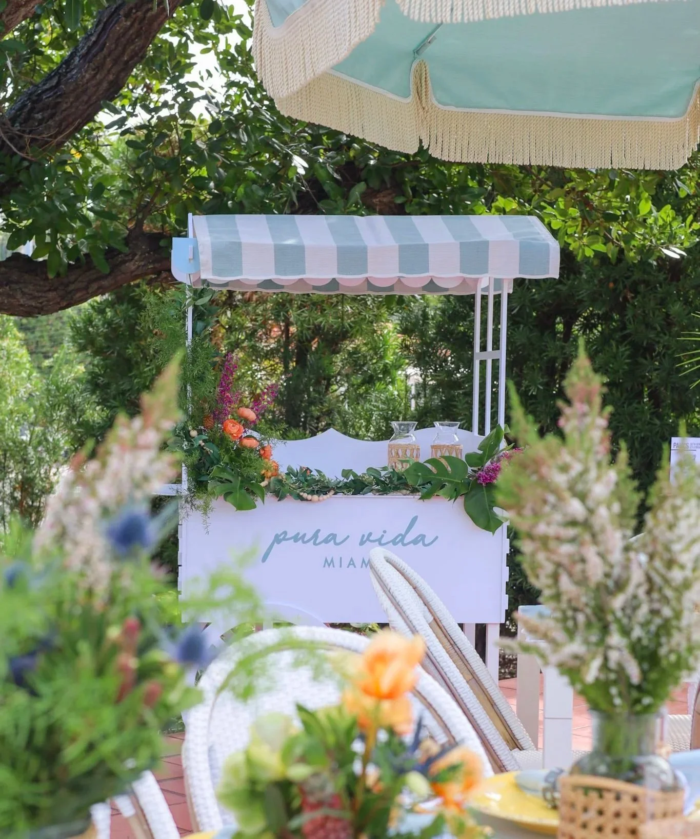 Pura Vida Miami cart placed in a decorated and colorful event space.