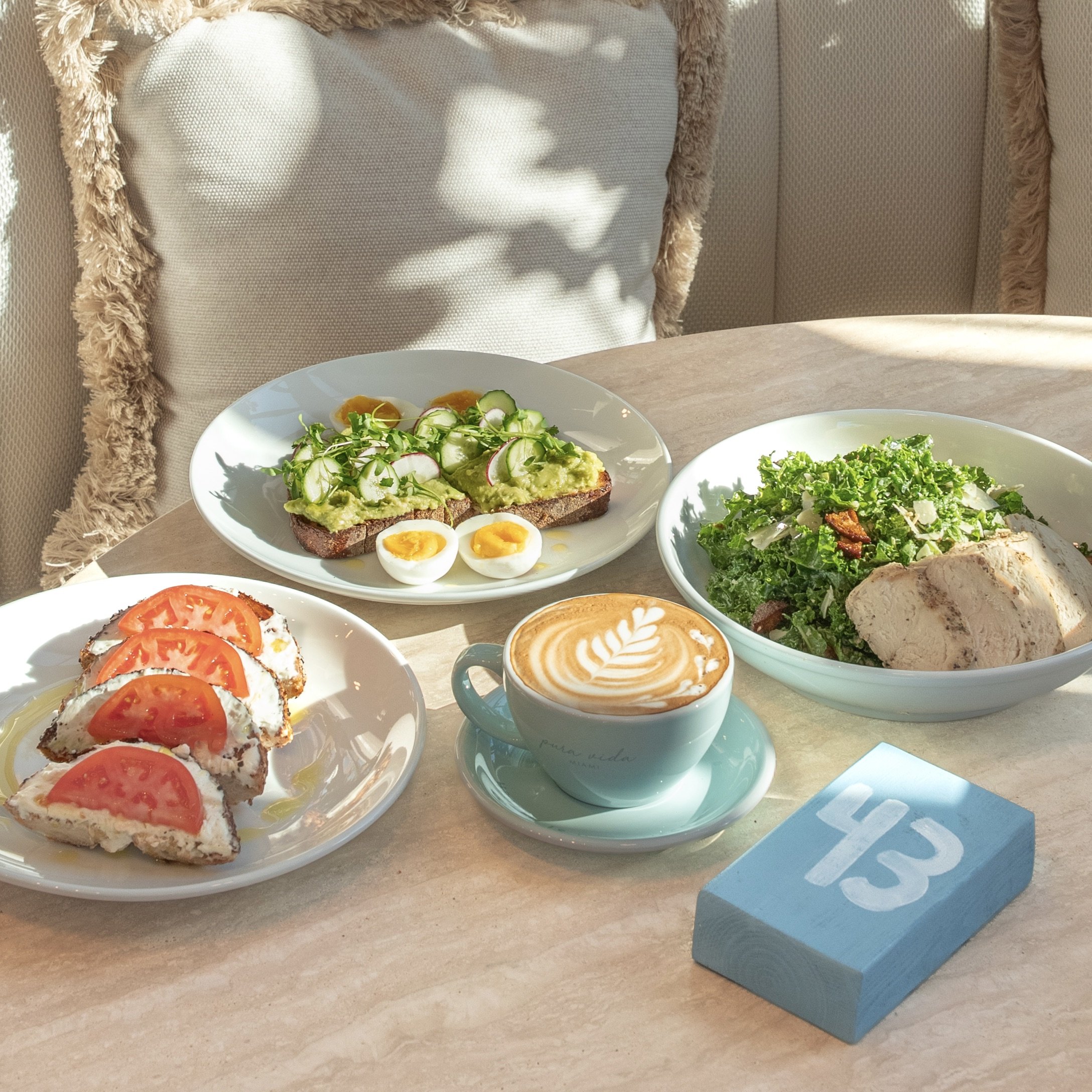 healthy brunch with toasts, bagels, coffee and salad