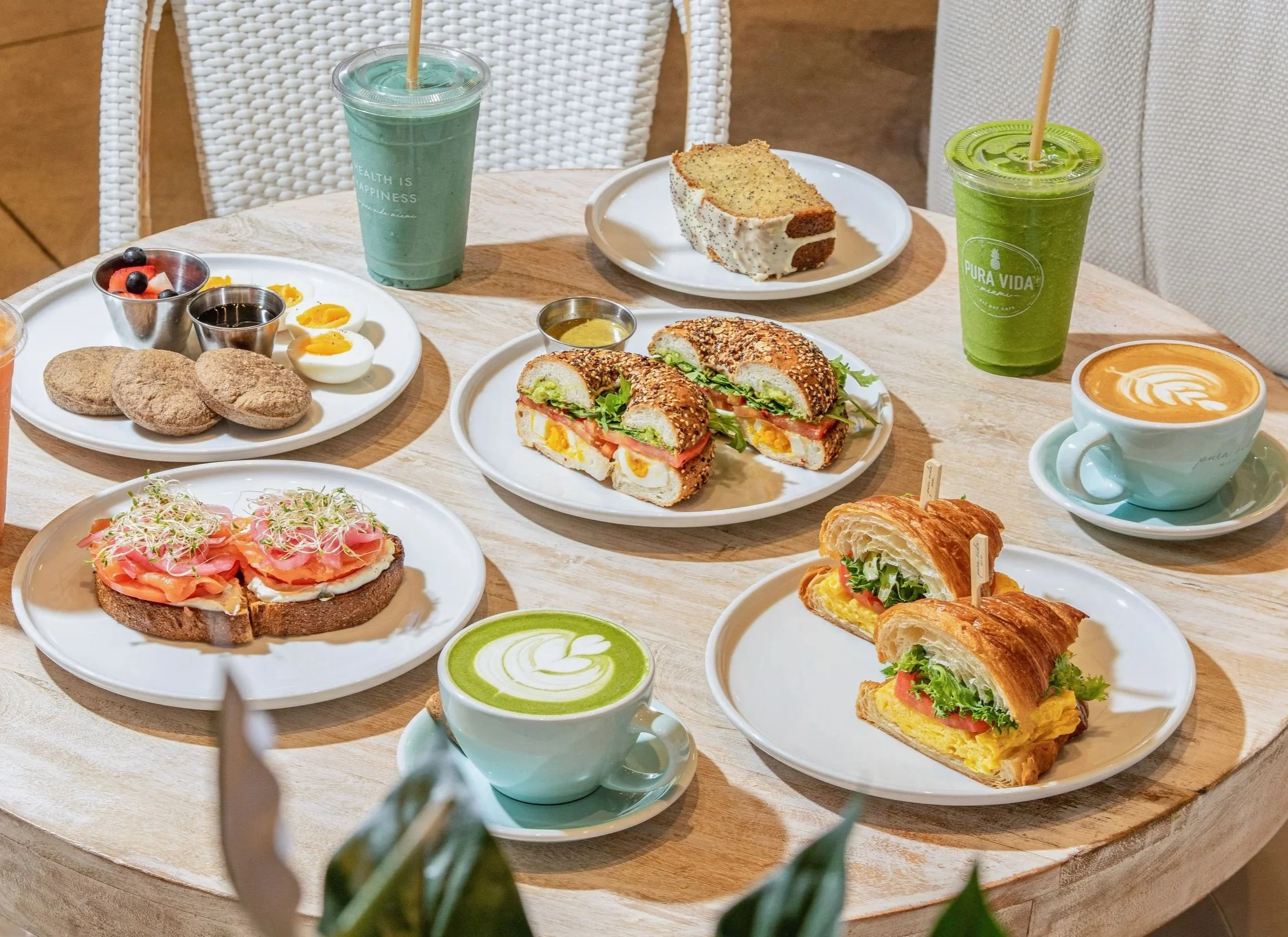all day breakfast table spread with perfect egg sandwich, new yorker toast, smoothies, coffees and matcha lattes