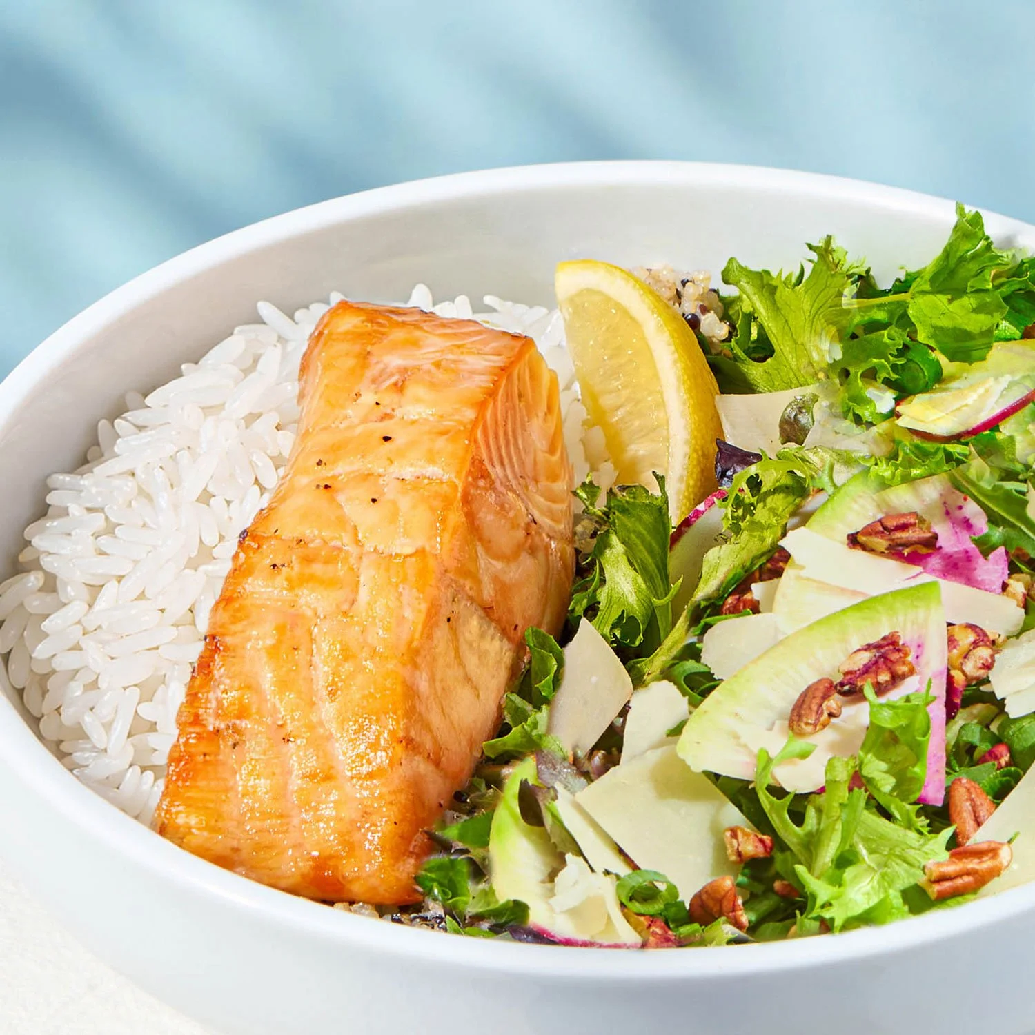 Protein plate with over roasted salmon, cilantro rice and side salad