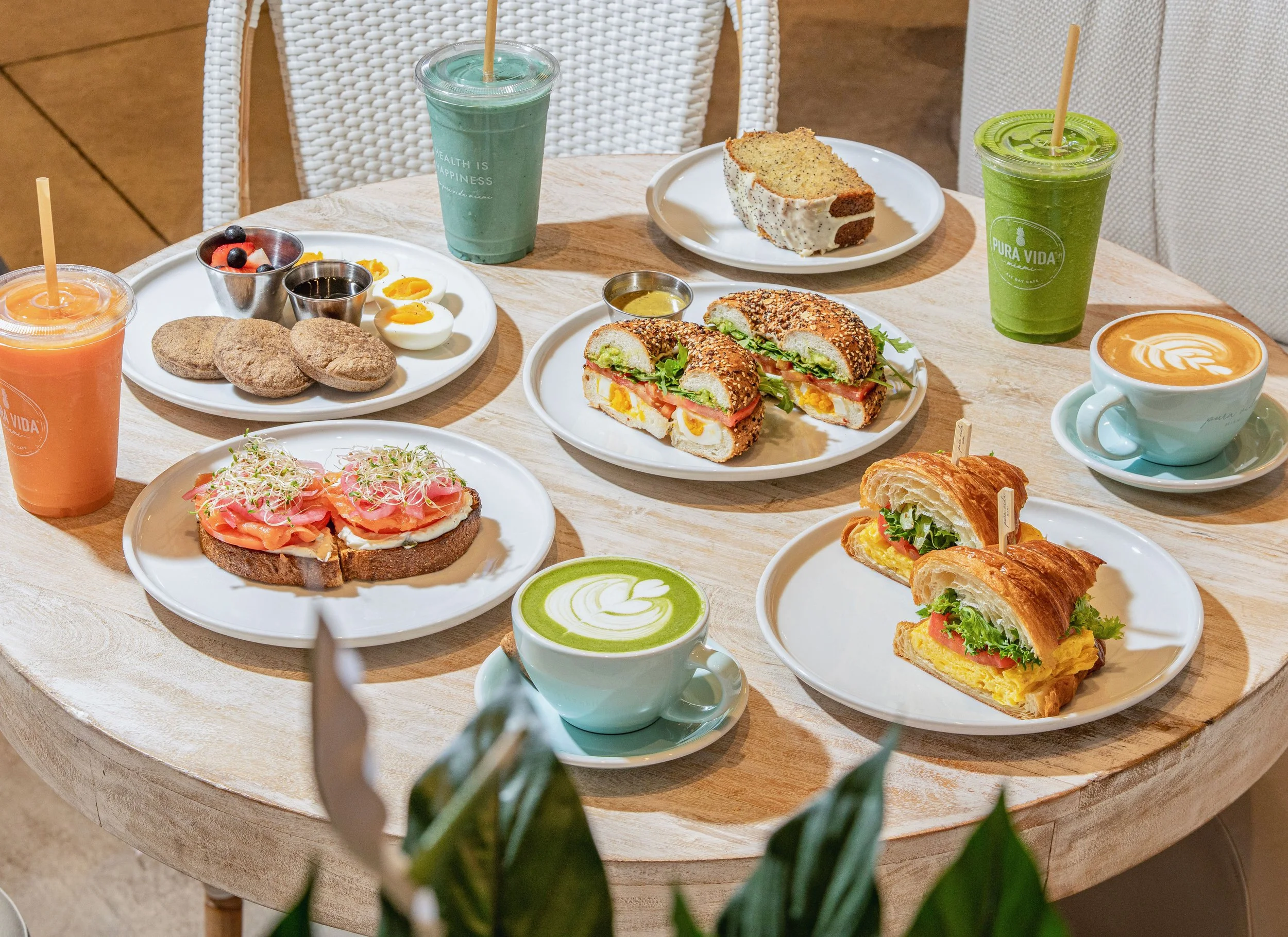 all day breakfast table spread with perfect egg sandwich, new yorker toast, smoothies, coffees and matcha lattes