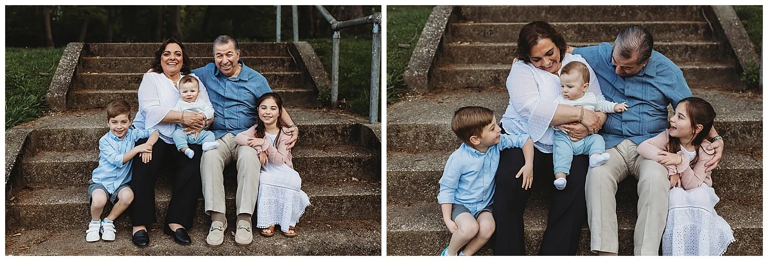 grandparents seated on concrete stairs with all of their grandchildren laughing a