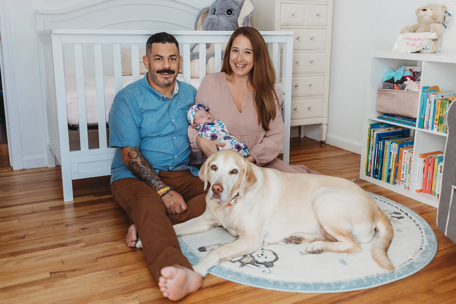 Lifestyle newborn family photo with dog included during Jacksonville newborn session