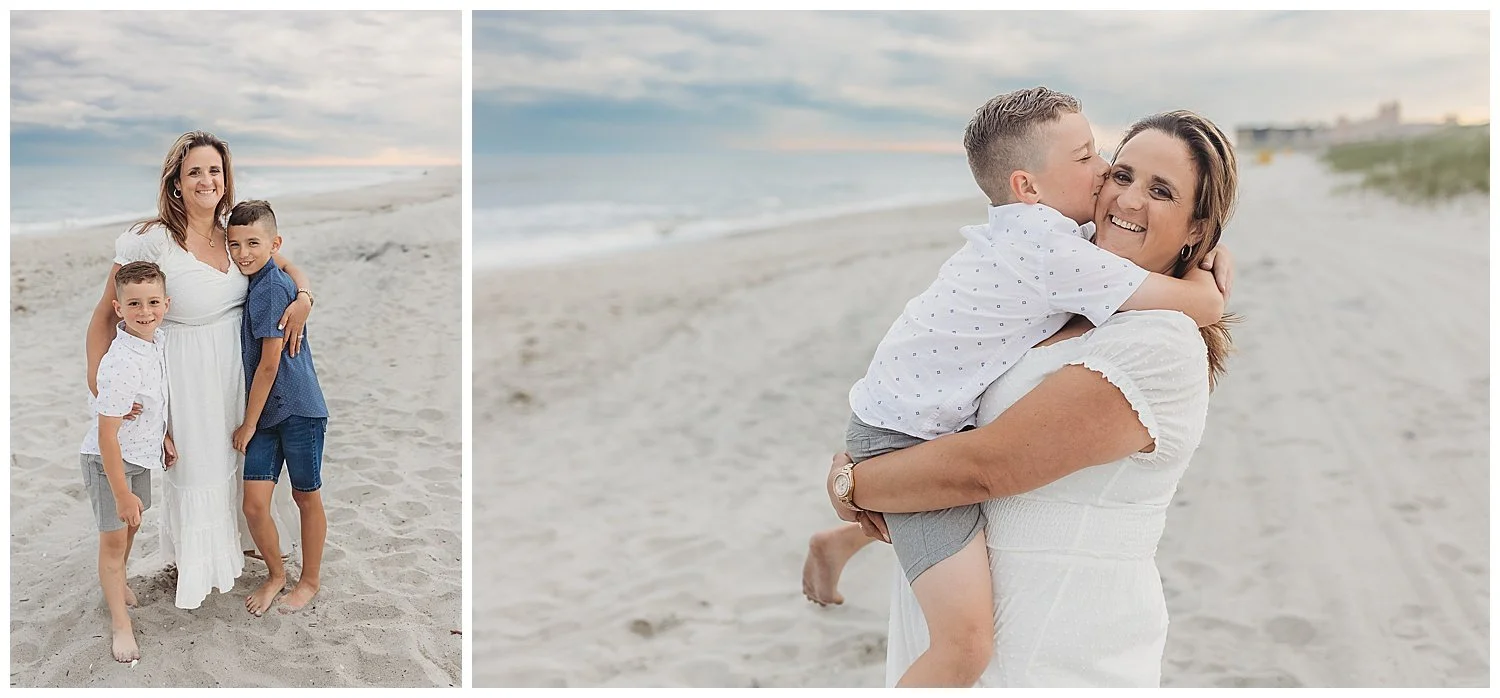 mother dressed in white holding son who is kissing her on the beach with sunset in background