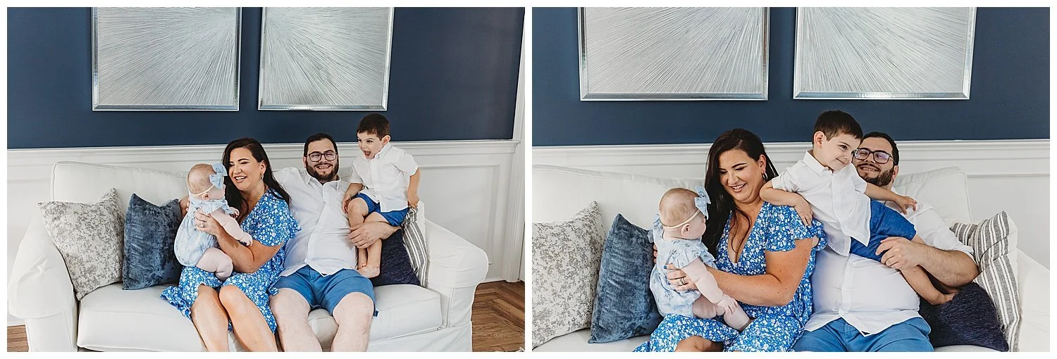 family seated on a couch in their living room playing with their children