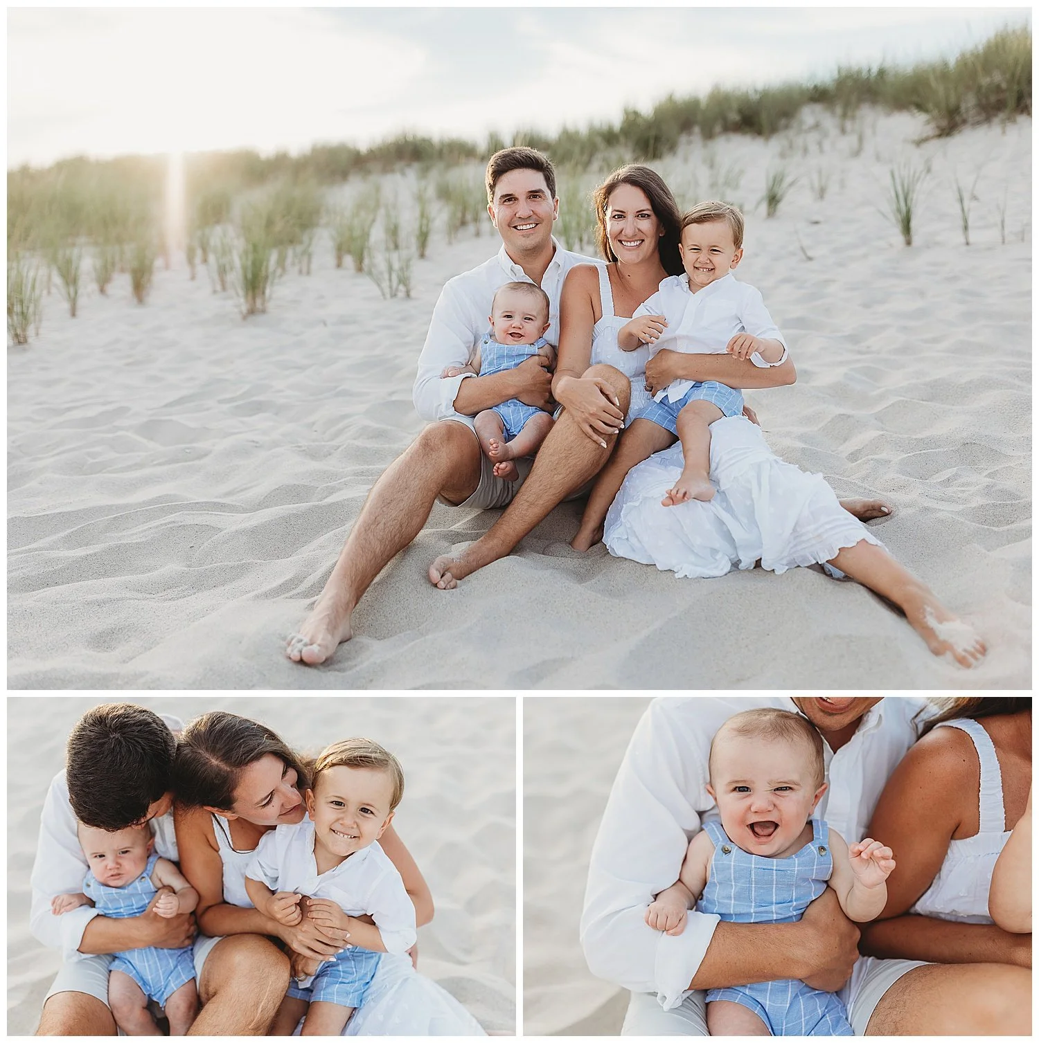 family dressed in white and blue with a baby and a toddler seated on the beach at sunset