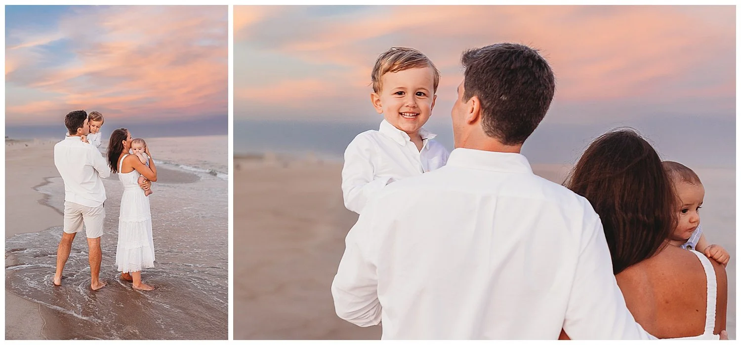 little boy peaking over dad's shoulder and their is a pink and orange sunset sky