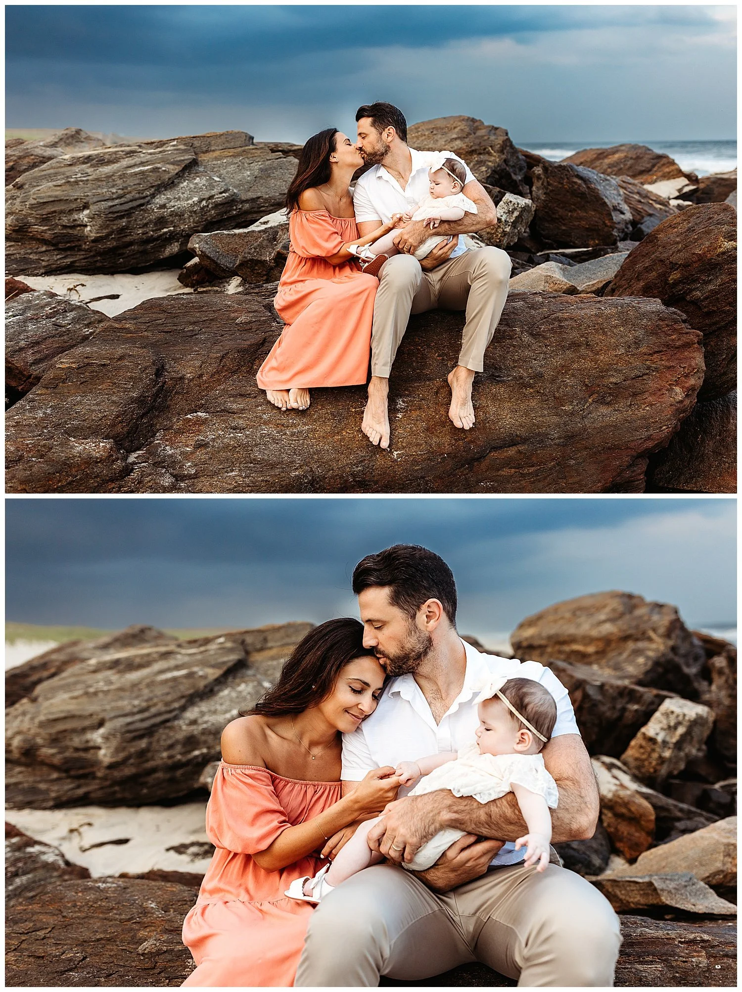 husband and wife seated on a jetty with dark cloudy blue skies behind them and dad is kissing mom on head while holding baby