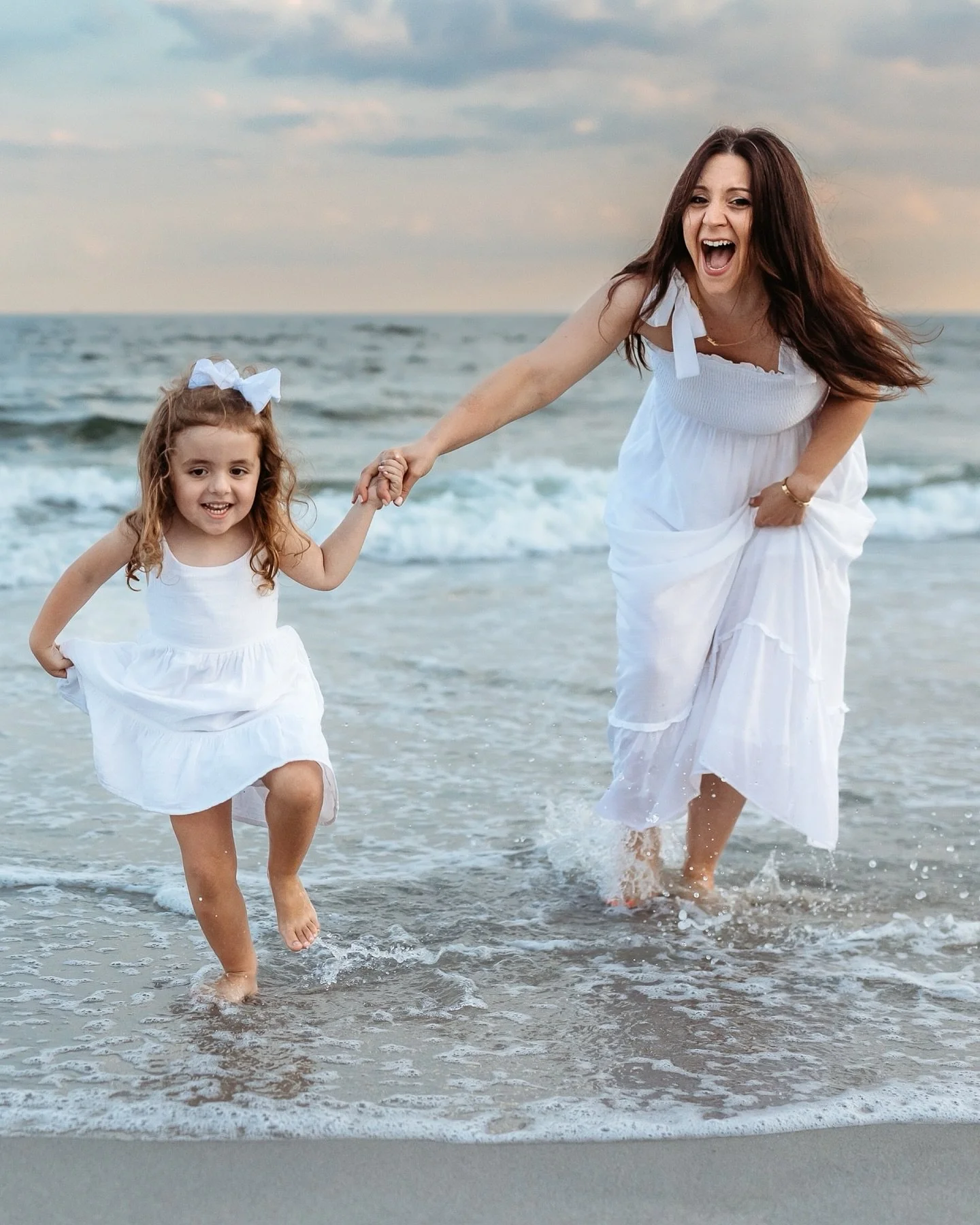 The sky was turning gold, the waves humming in the background, and big sister was running toward the tide with all the determination in the world.
This family session only took twenty minutes, but in that time, we caught it all&mdash;the light, the l
