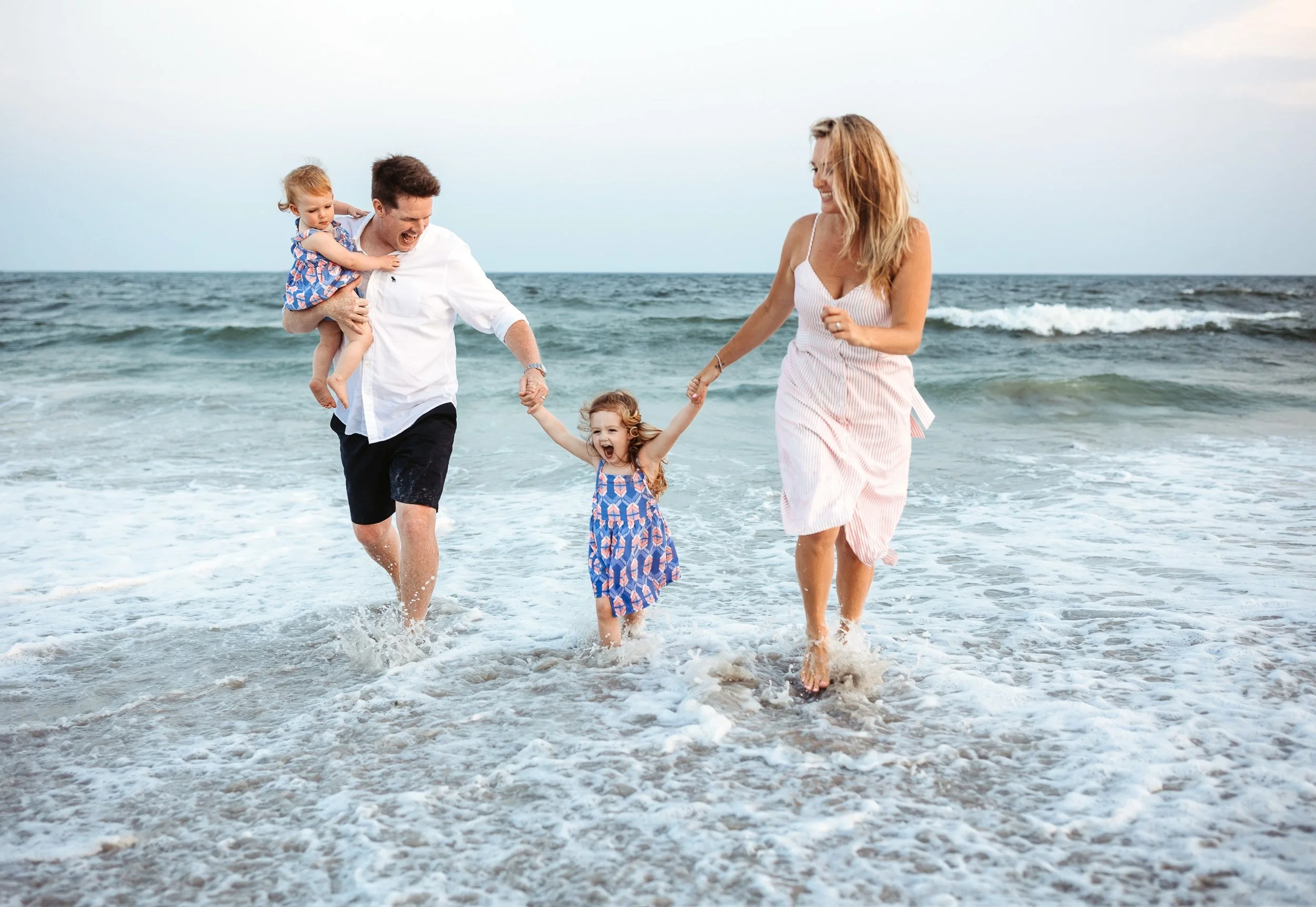 When the waves are coming in and nobody wants to stop for a photo, you just capture the moment instead. This is exactly what a beach vacation session looks like and honestly I would not have it any other way. If your family is heading to the St Augus