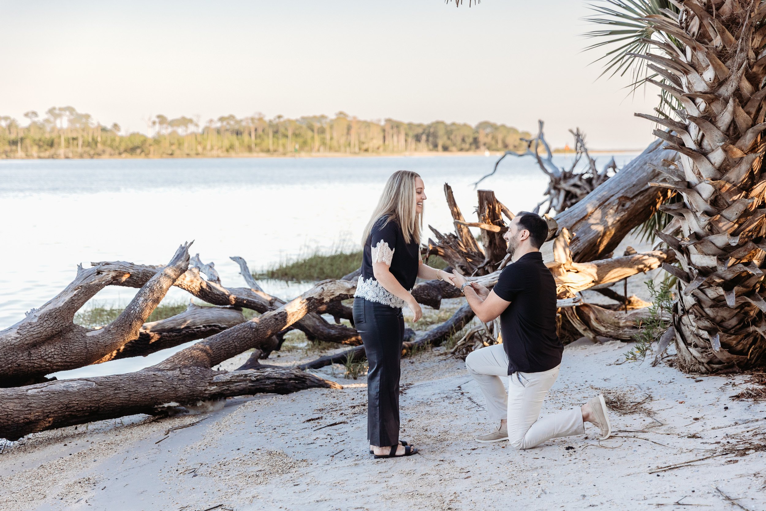 couple getting engaged on the water in nocatee